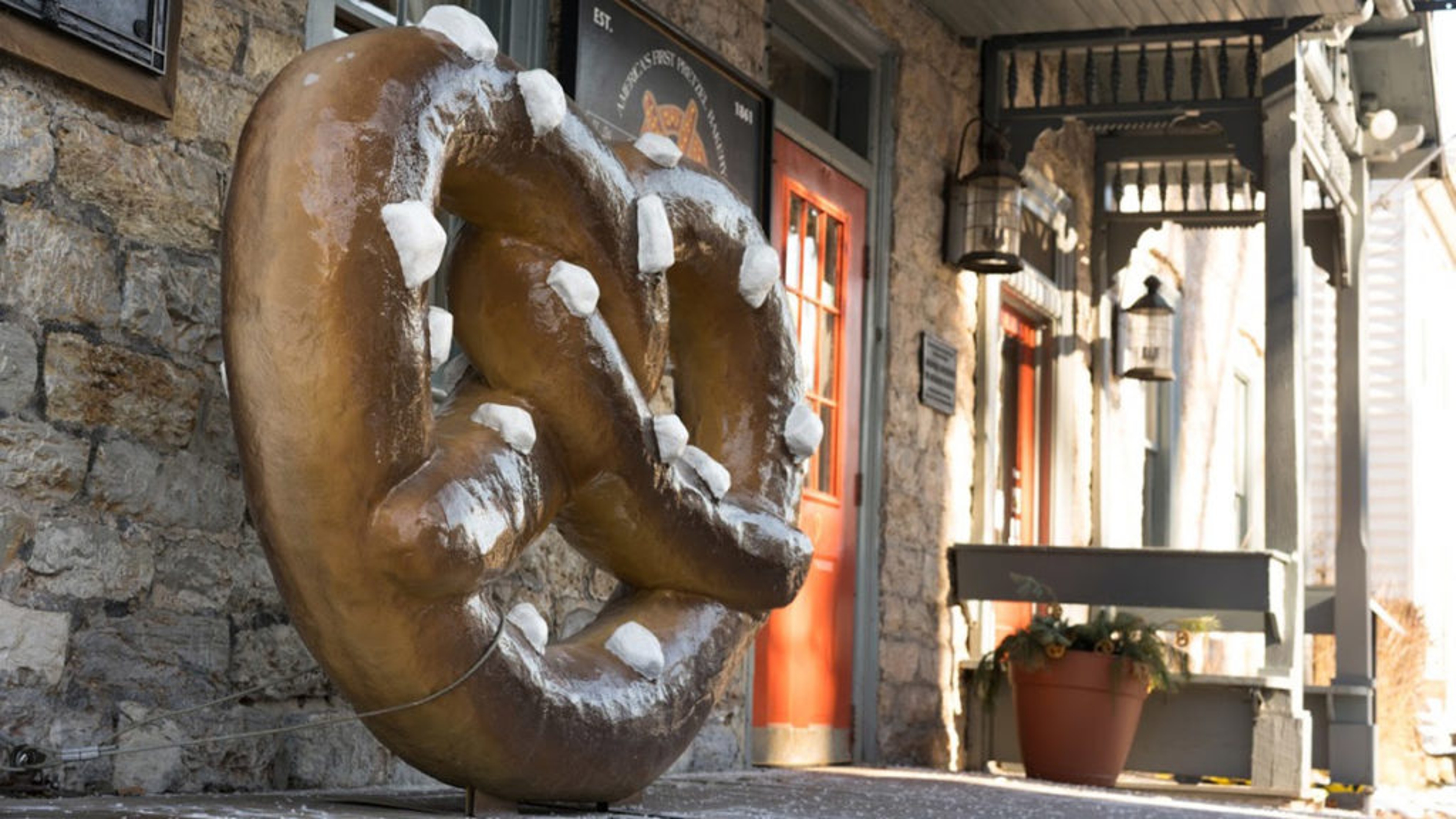 History of pretzels with a large pretzel sculpture at an old bakery.