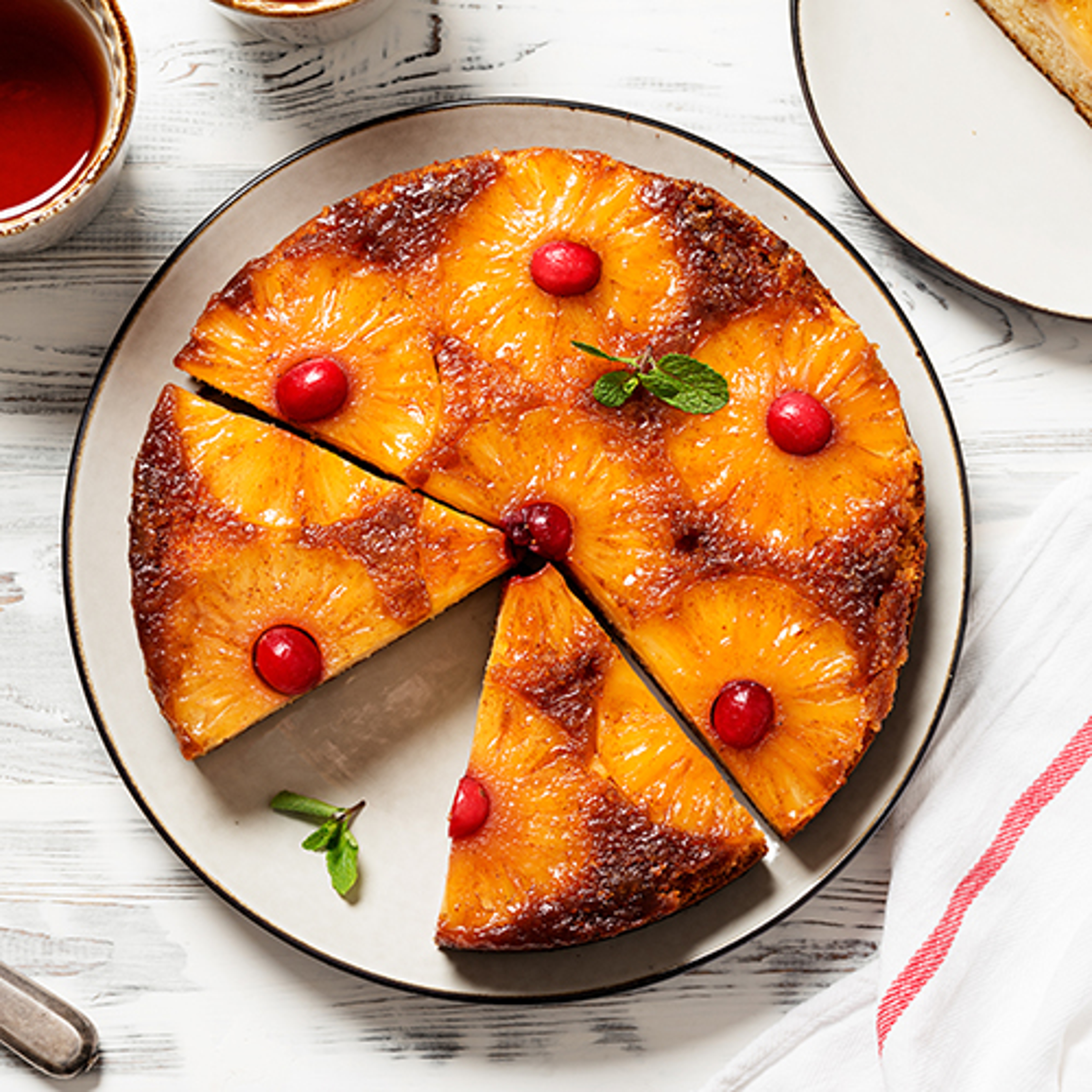 Homemade pineapple upside down pie with candied cranberry . Trop