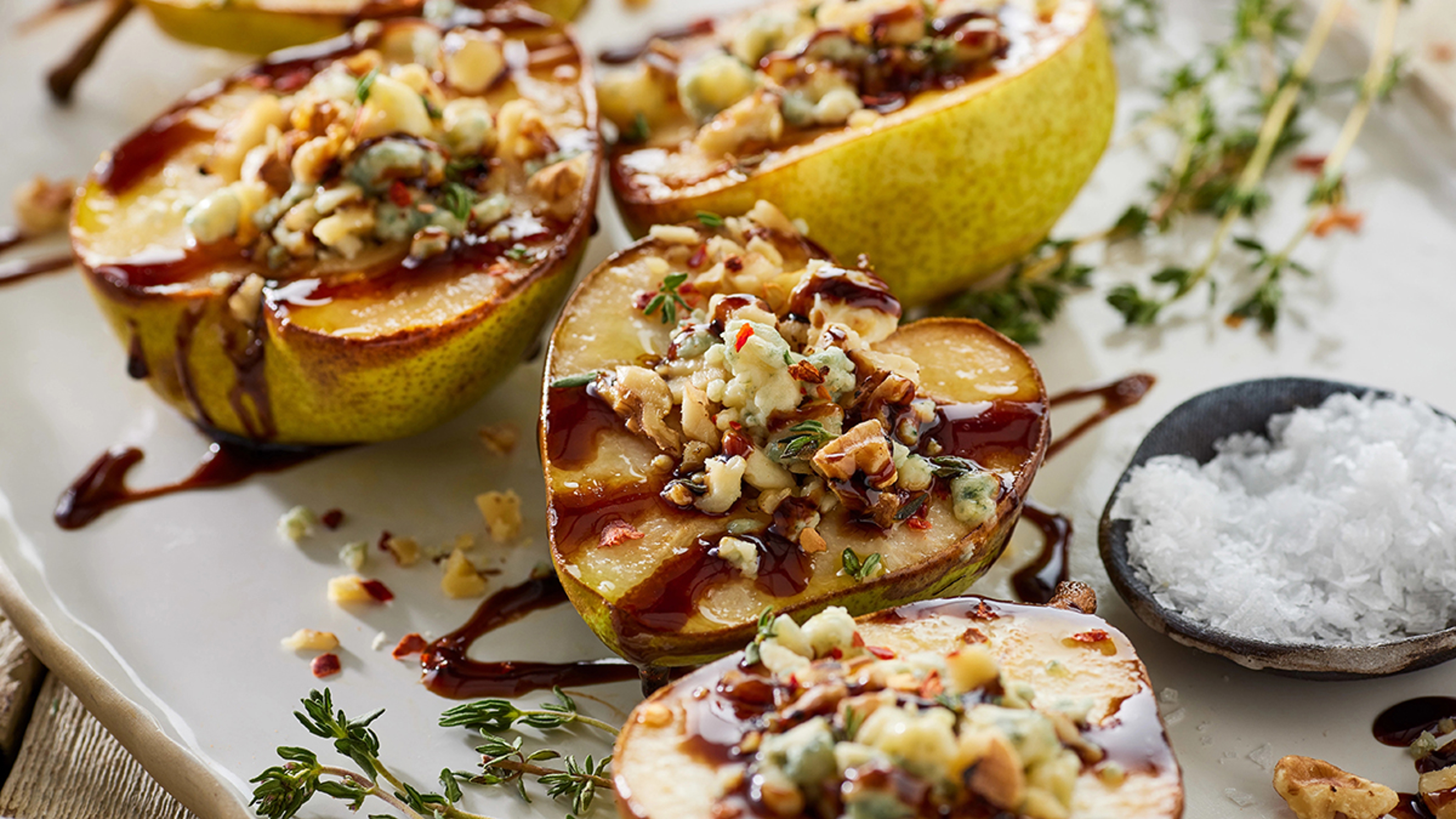 Sliced pears stuffed with blue cheese and drizzled with balsamic vinegar.