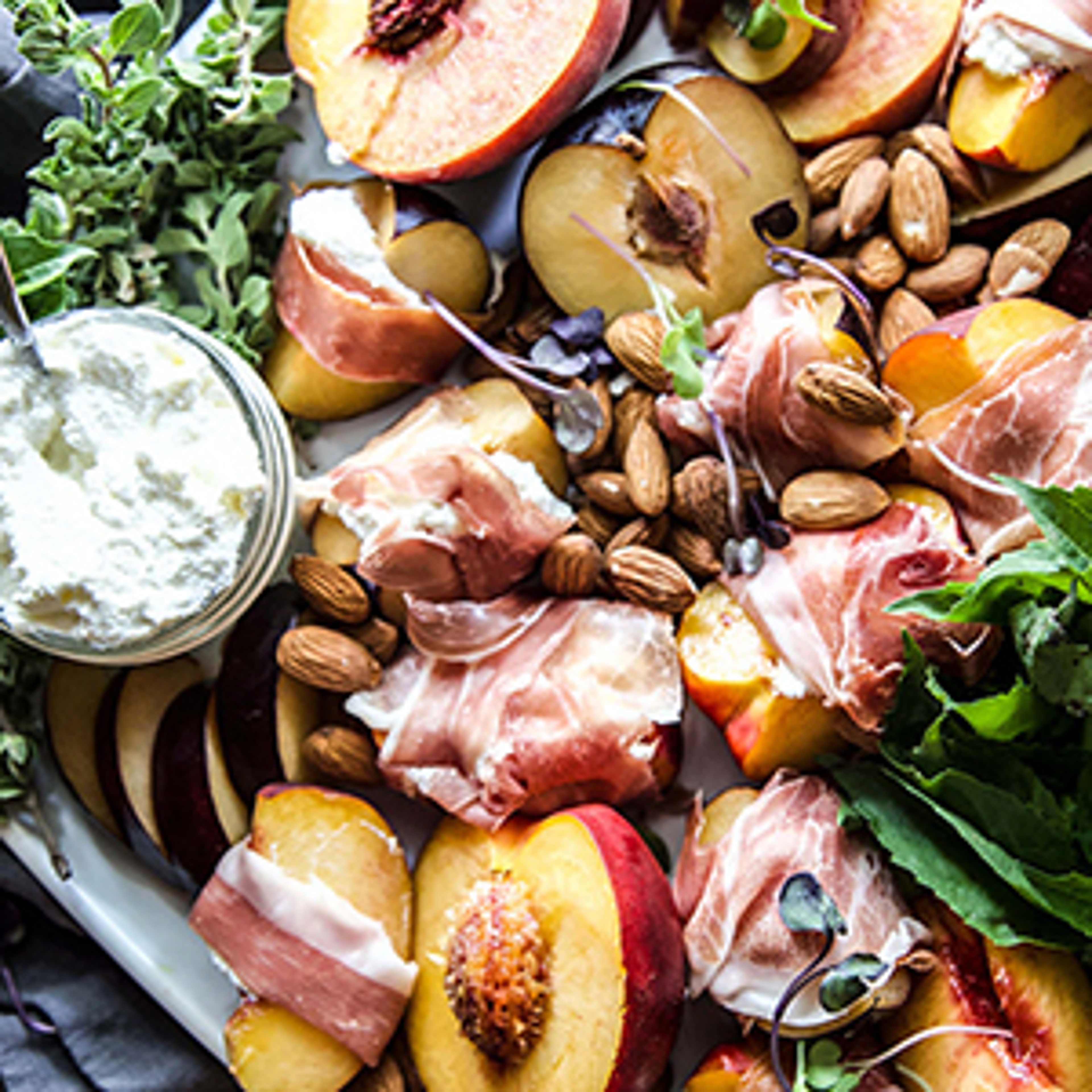 Plums and nectarines cut in quarters and wrapped in prosciuttio.