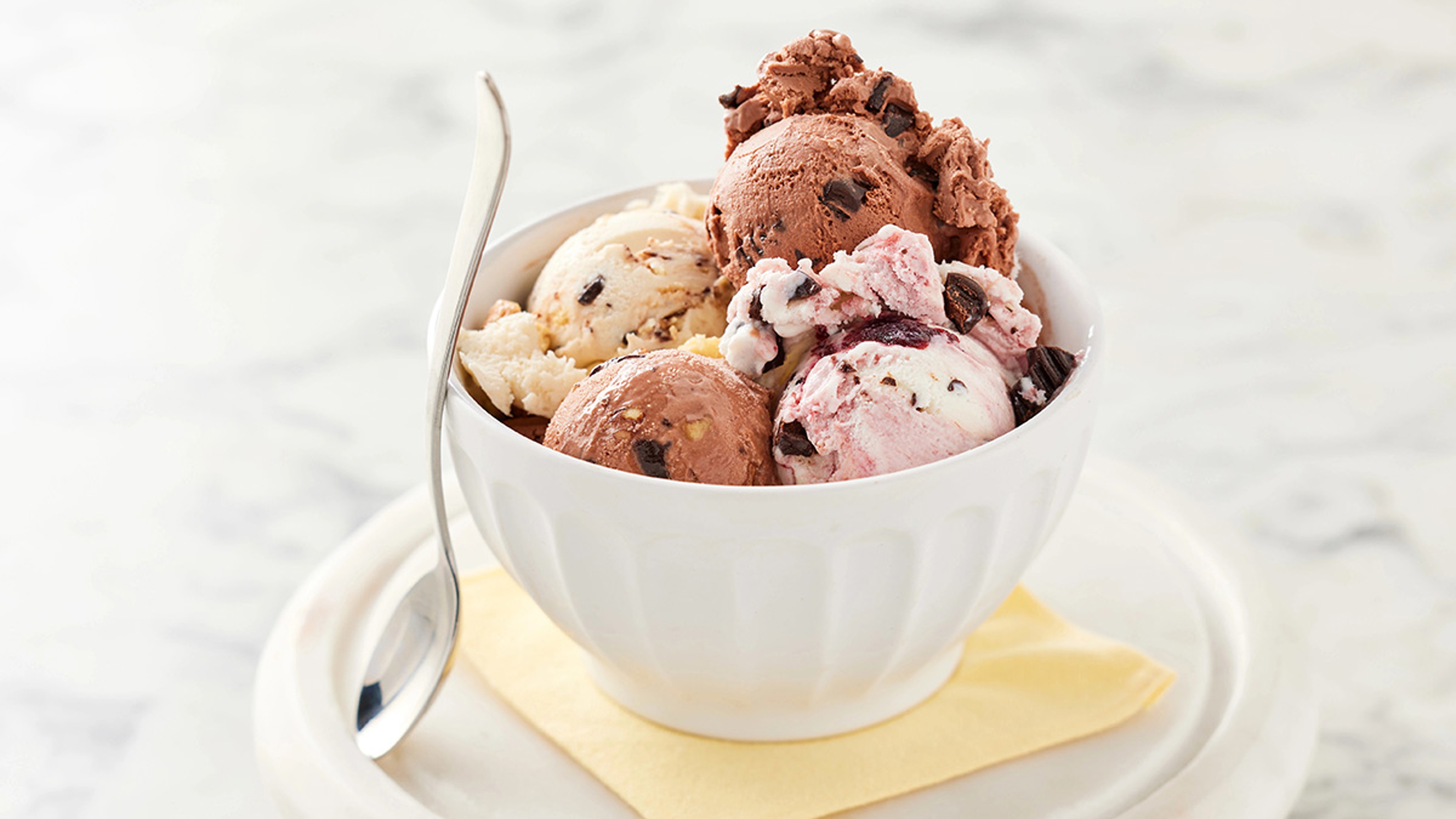 Bowl of different flavors of ice cream.