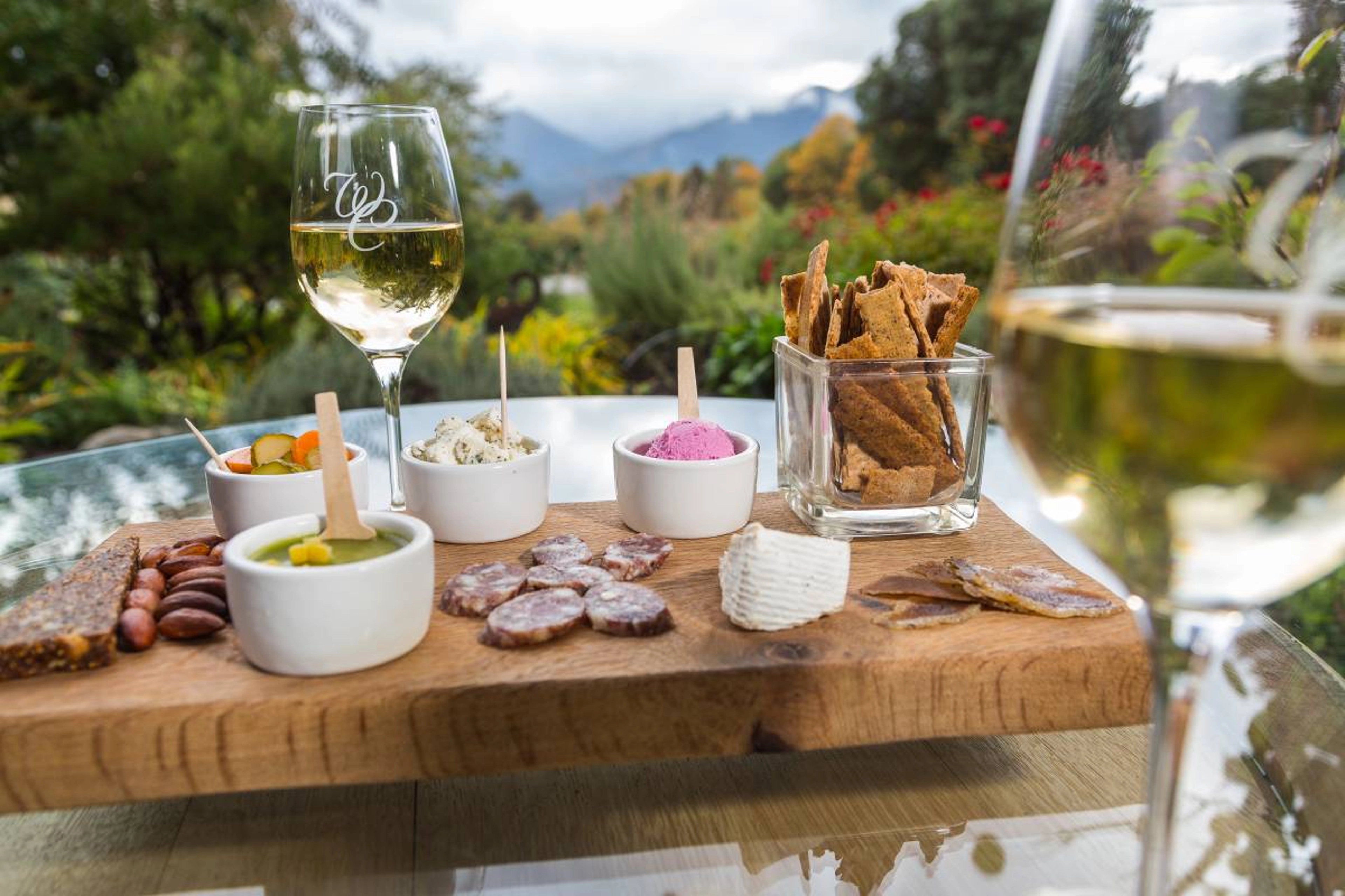 Spread of cheese, meat, and wine.