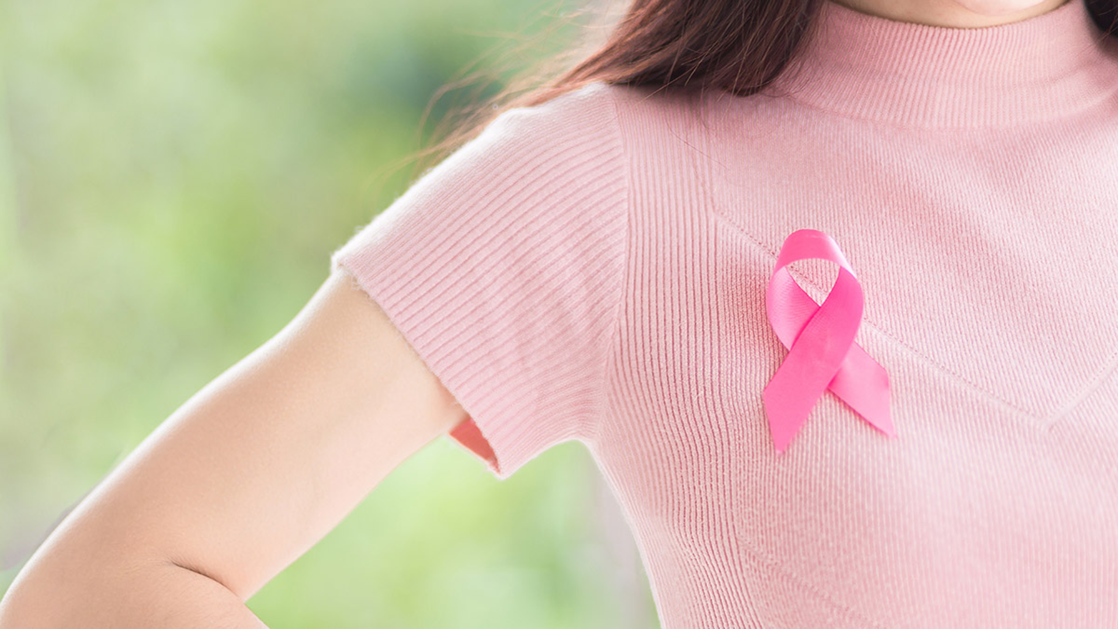 Article Cards Featured Image Close up Happy woman with a pink ribbon for Prevention Breast