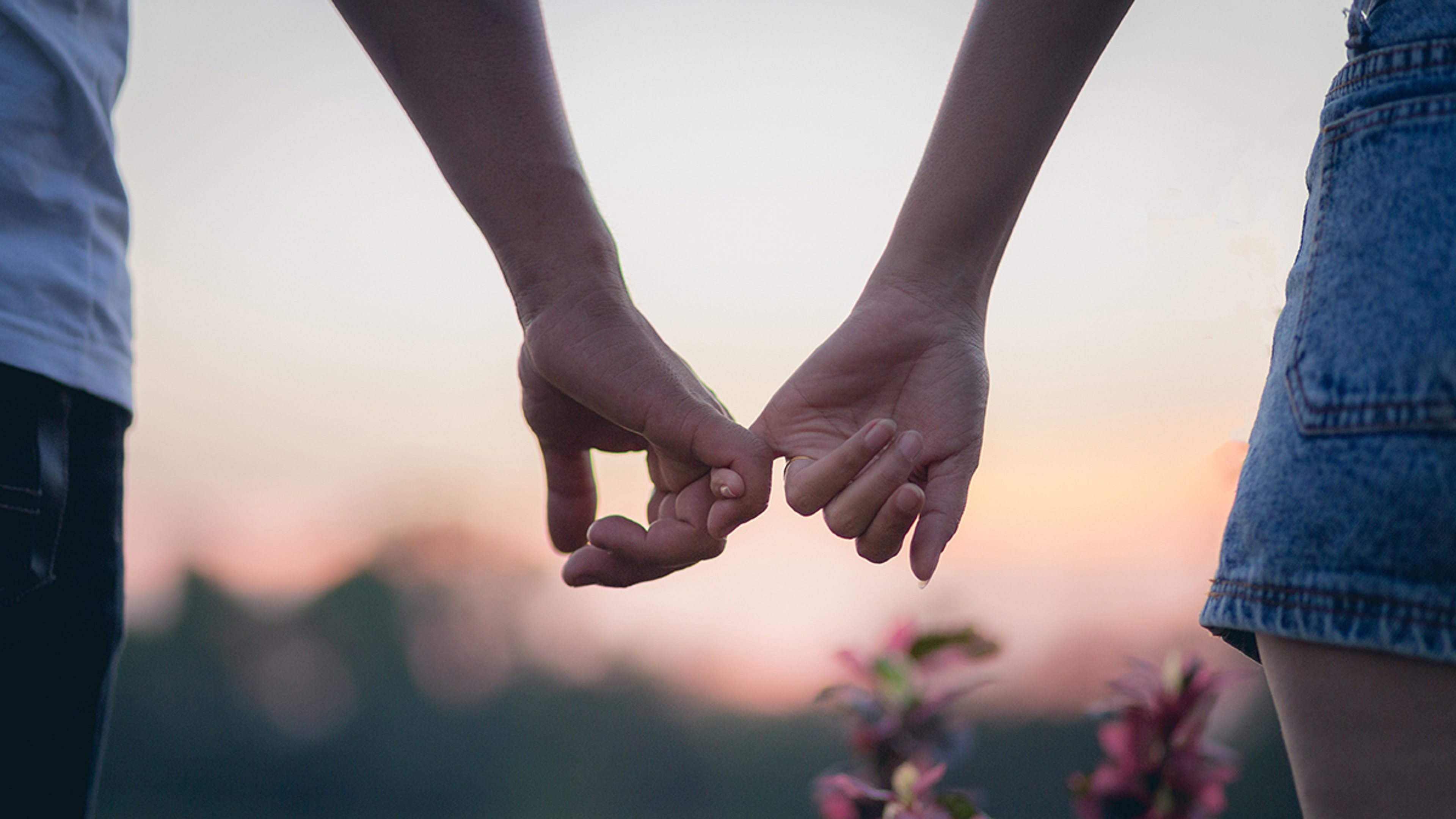 Couple in love holding hearts.