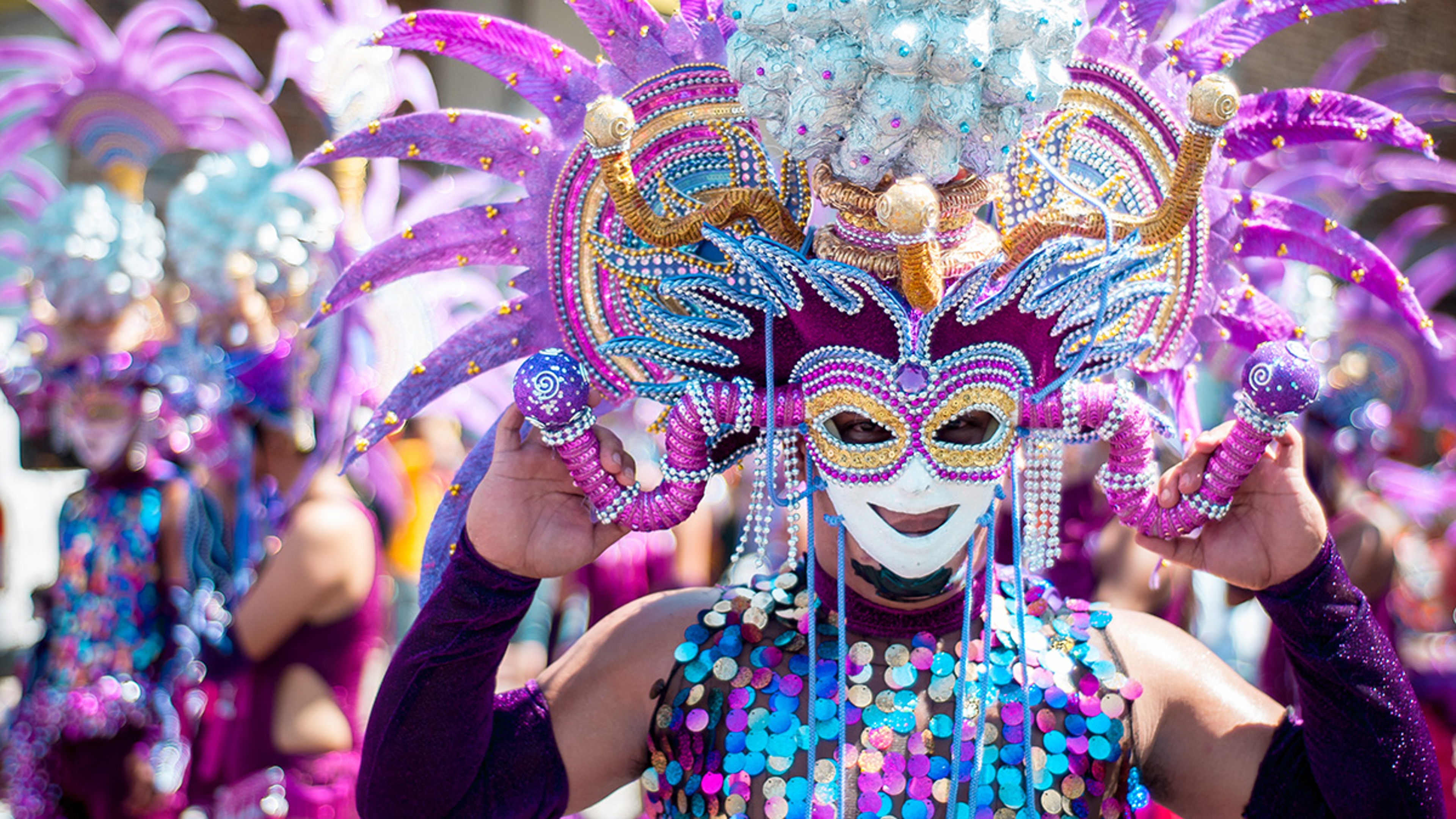 Masskara Festival street dance parade participant facing the camera.