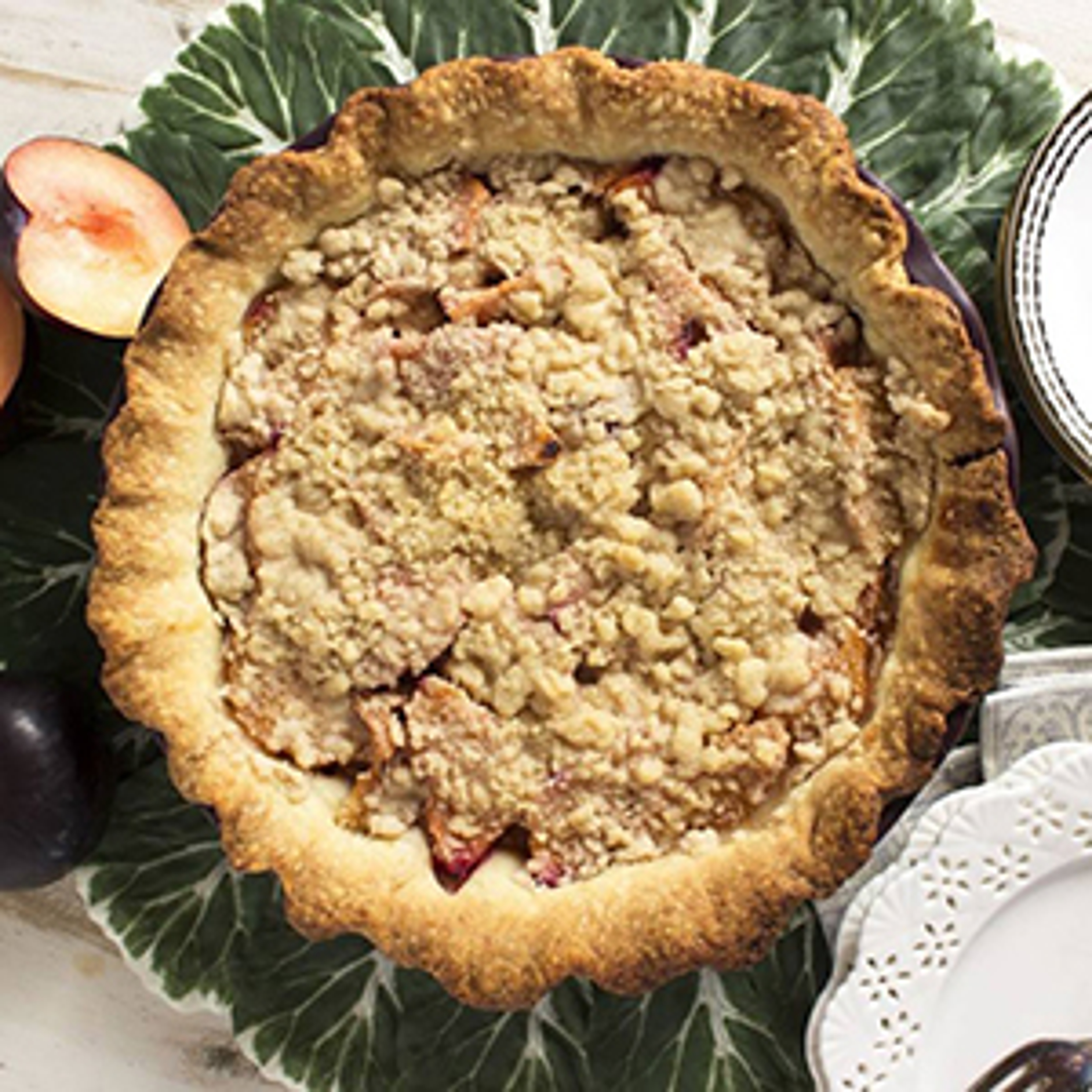 Above shot of a plum pie with a streusel topping.