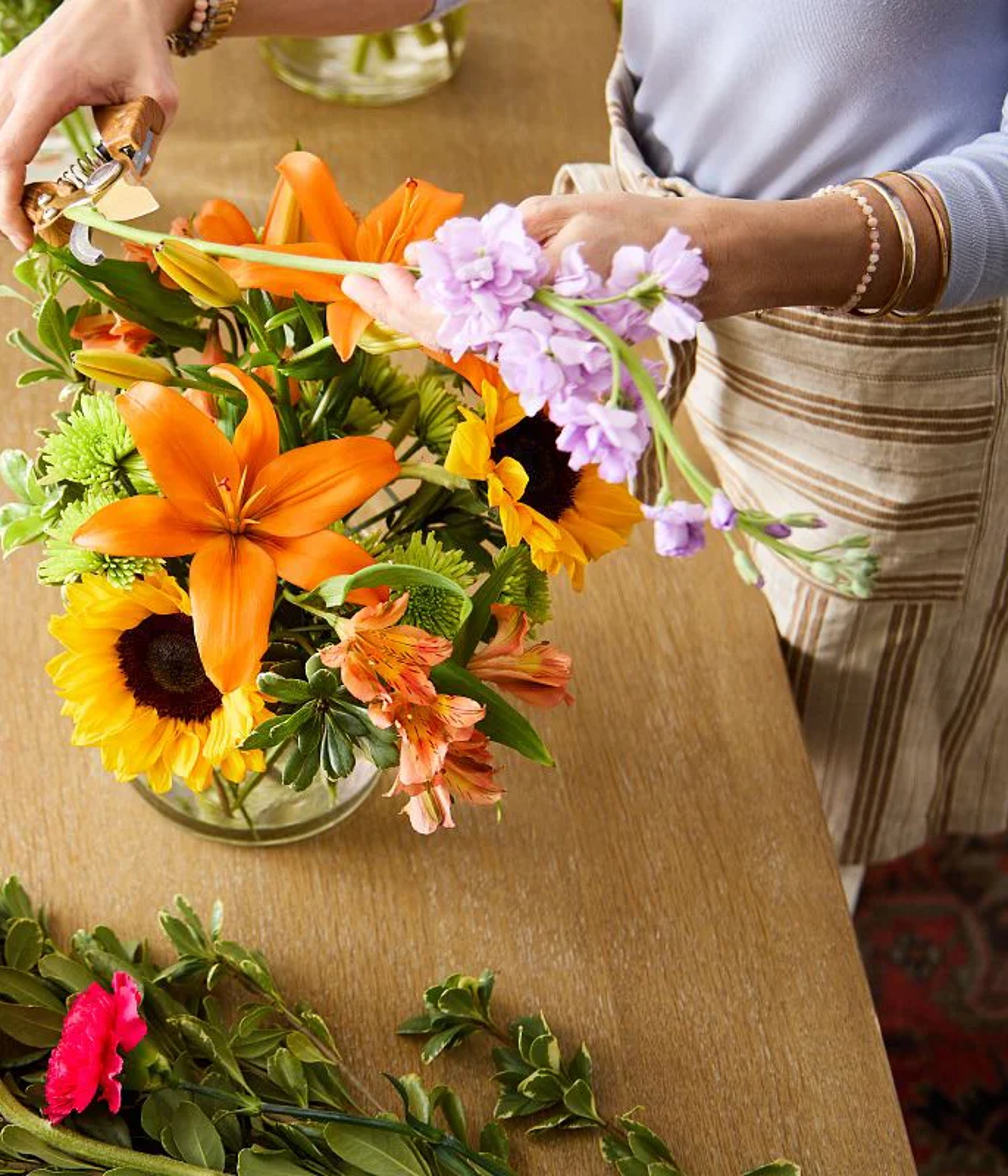 florist creating a hand made arrangement