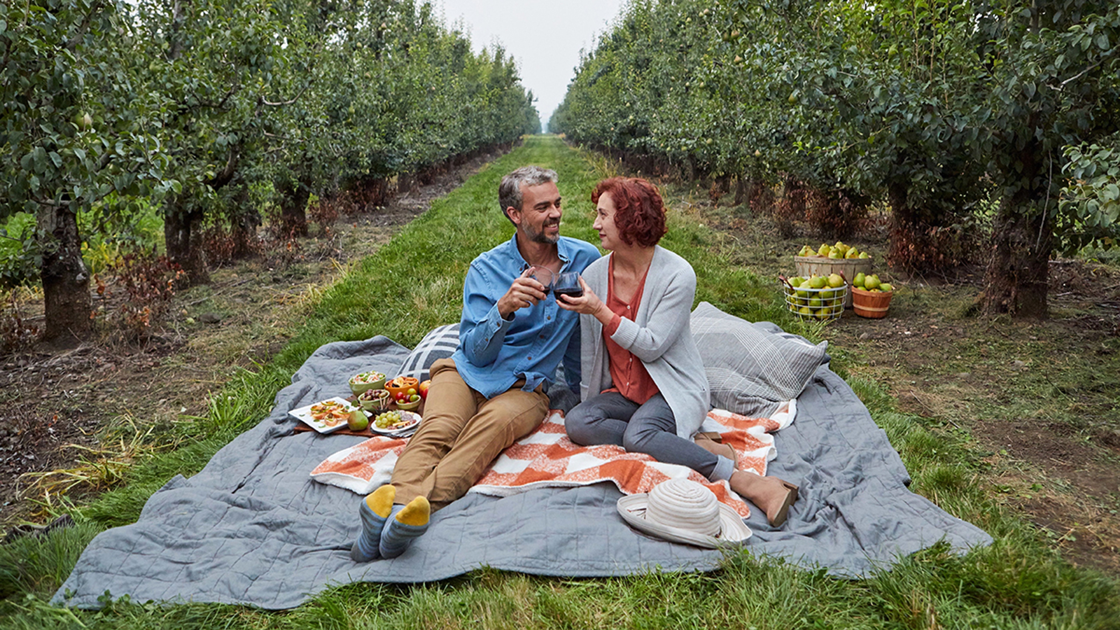 Article Cards Featured Image fall wine pairings couple in orchards x