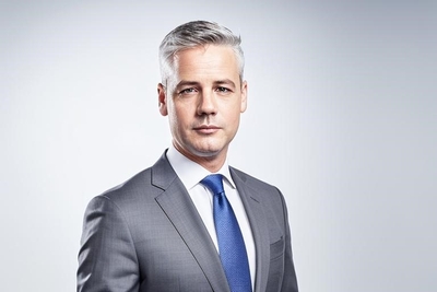 headshot of John Eakins