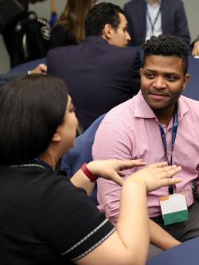 A man and a woman talking at a Privacy Bar section meetup