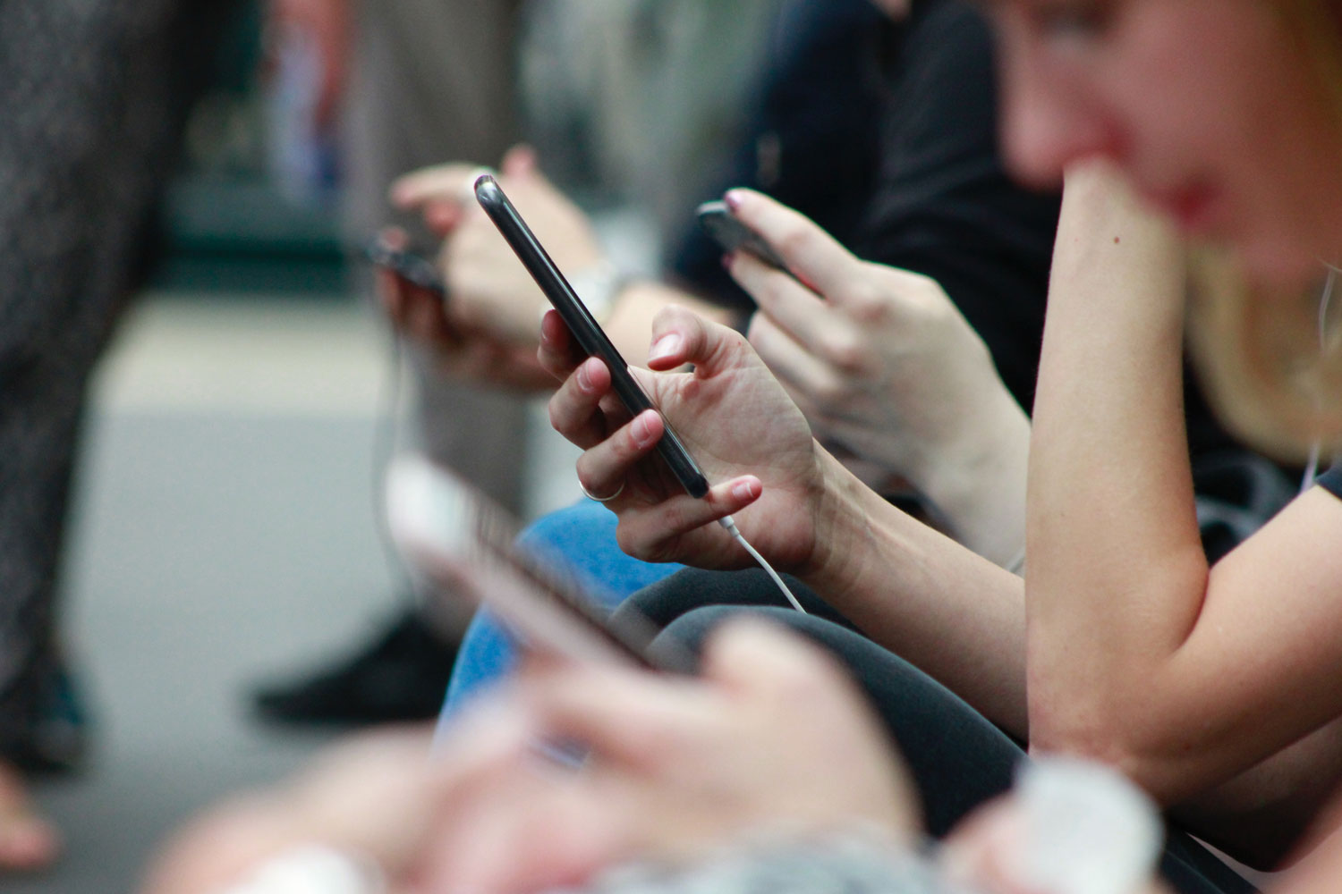 people staring at their phones