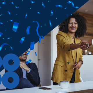 Woman shaking hands with celebration confetti behind her