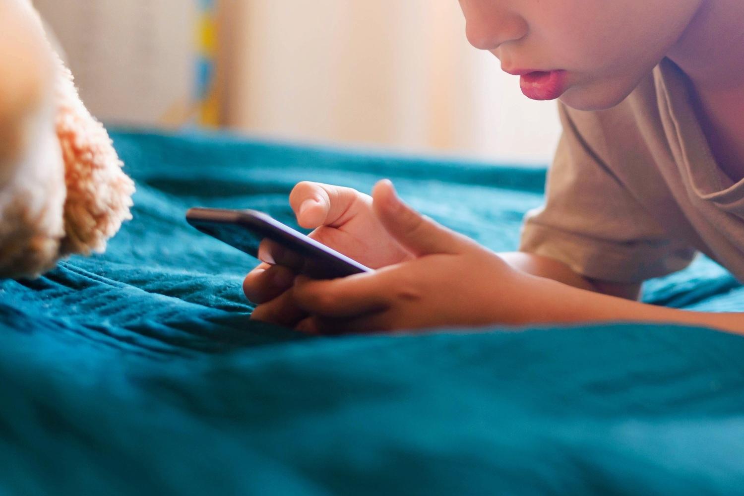 boy-lying-phone-childrensprivacy-012926.jpg