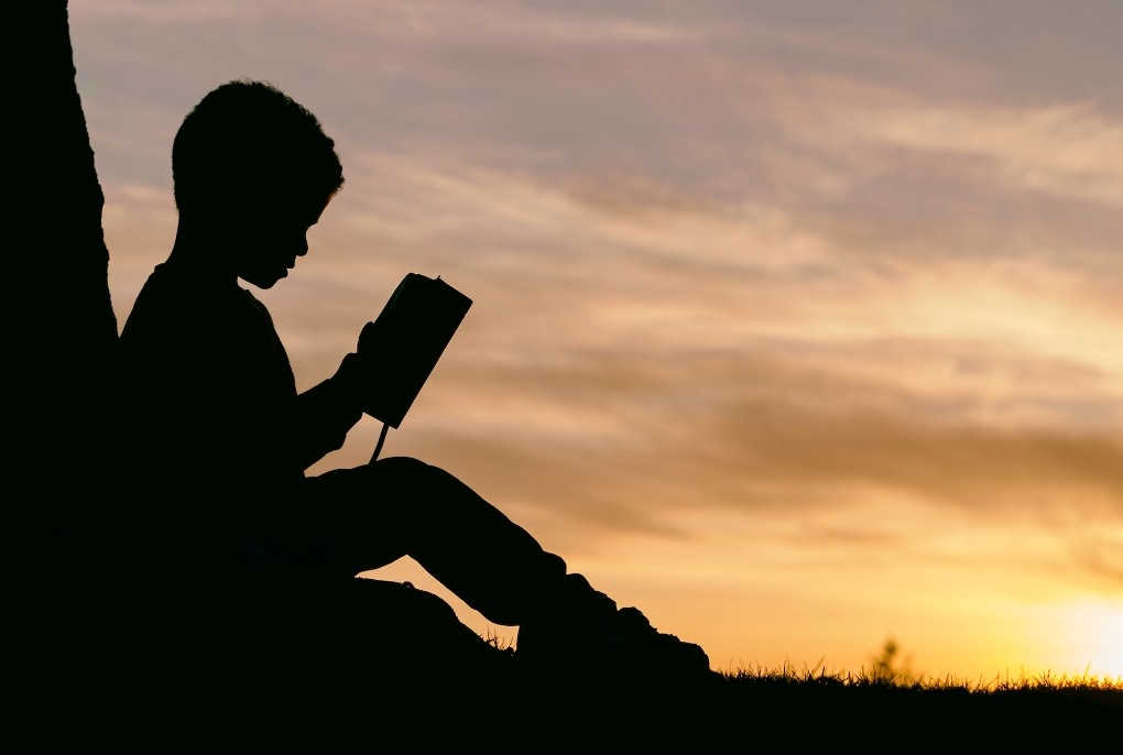 child-reading-sunset.jpg