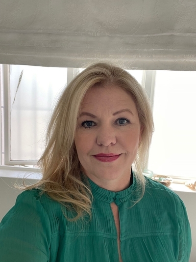 headshot of Janine West