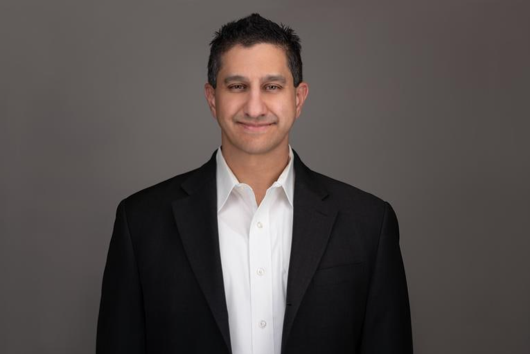 headshot of Dennis Dayman