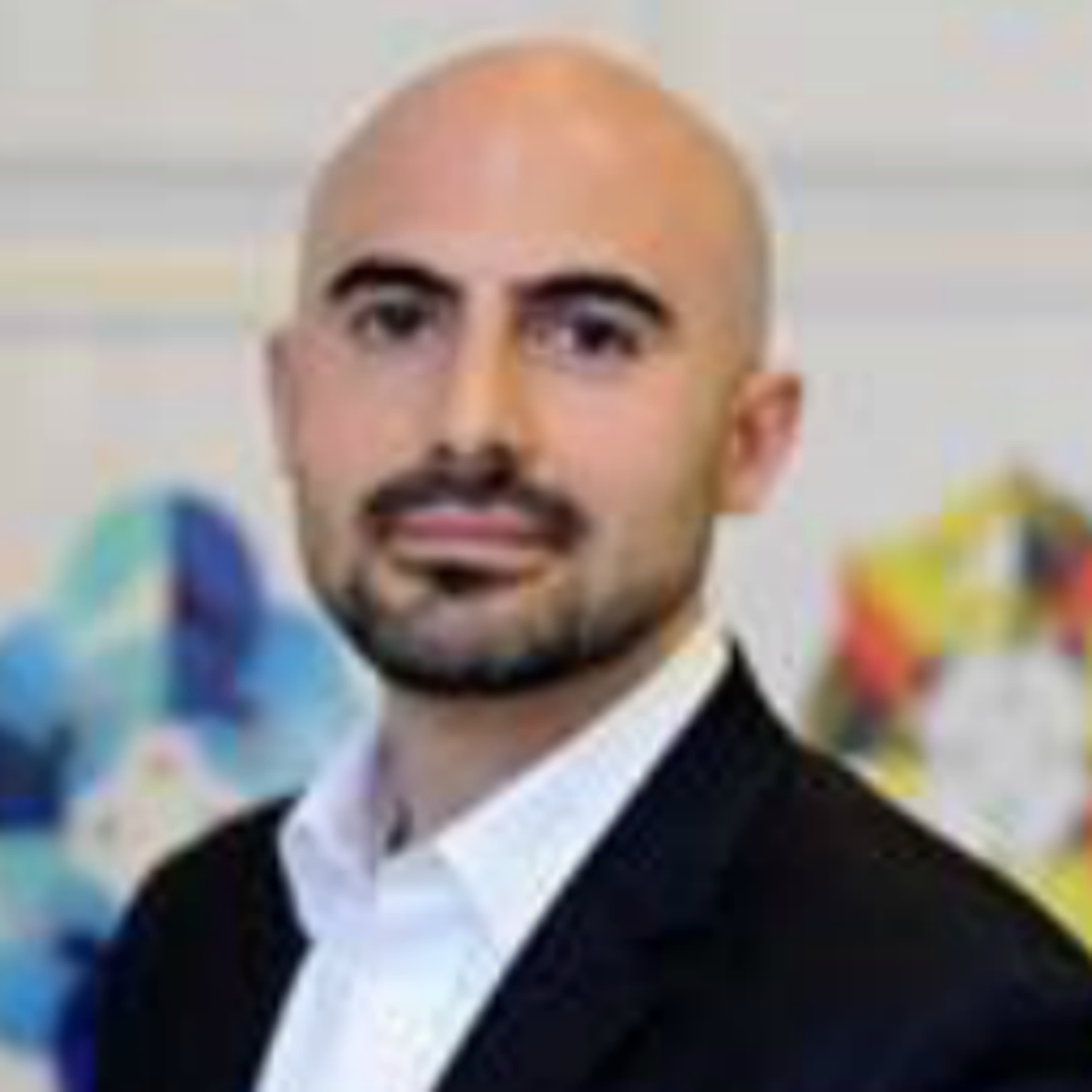 headshot of Ali Vaziri