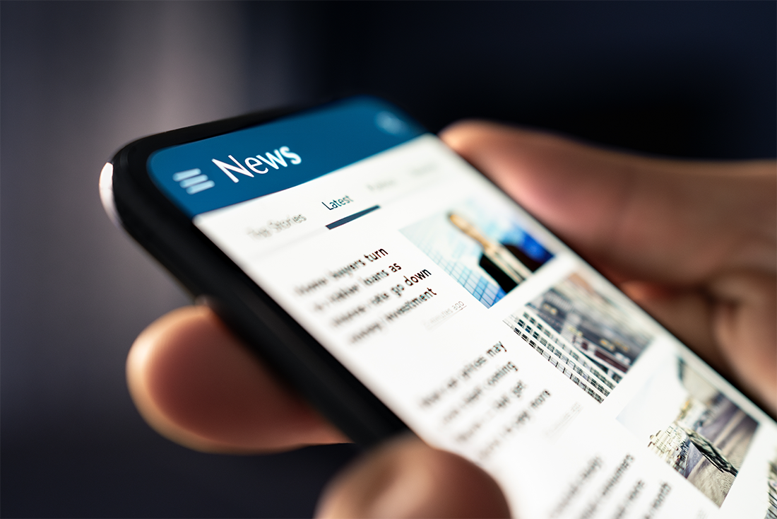 close up of a smart phone with a news article on the screen