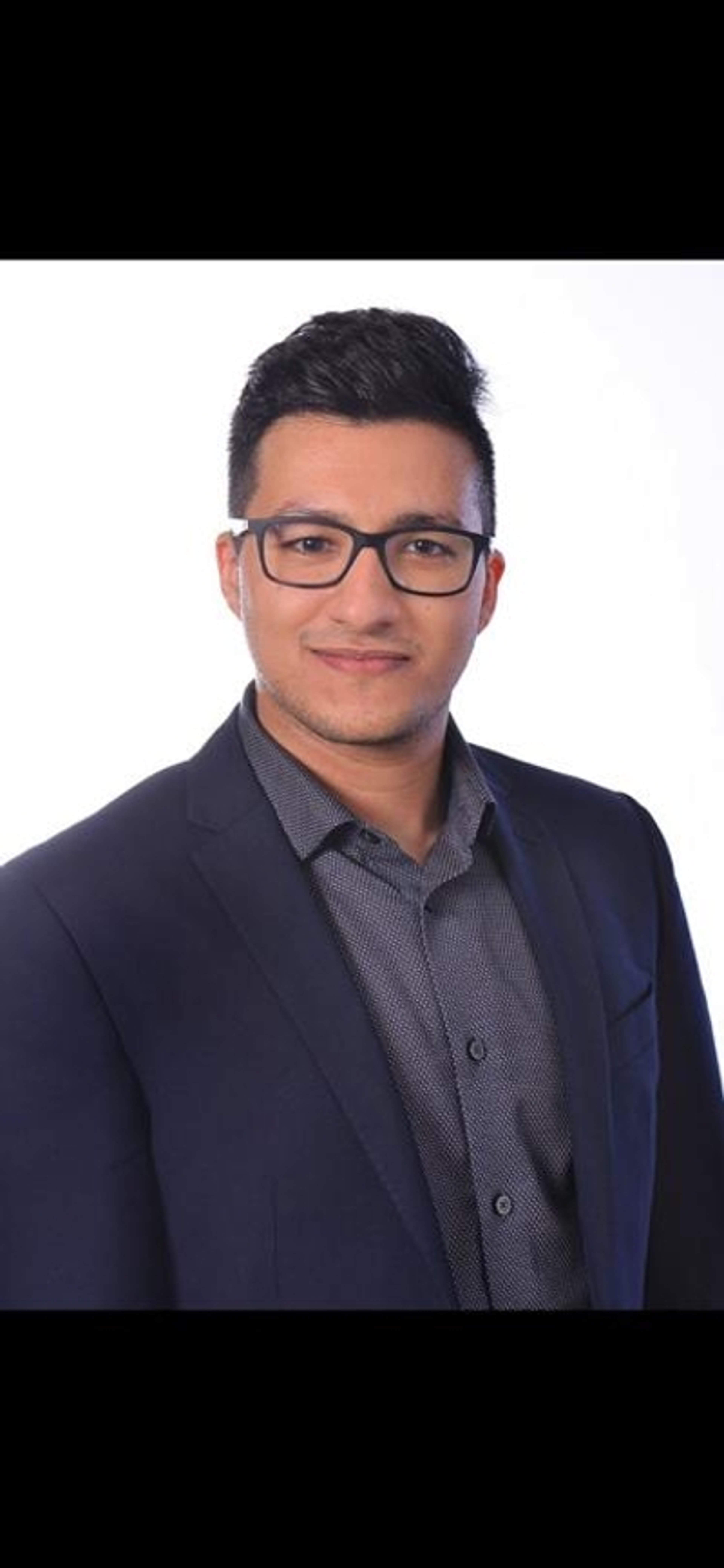 headshot of Hussein Abdulghani