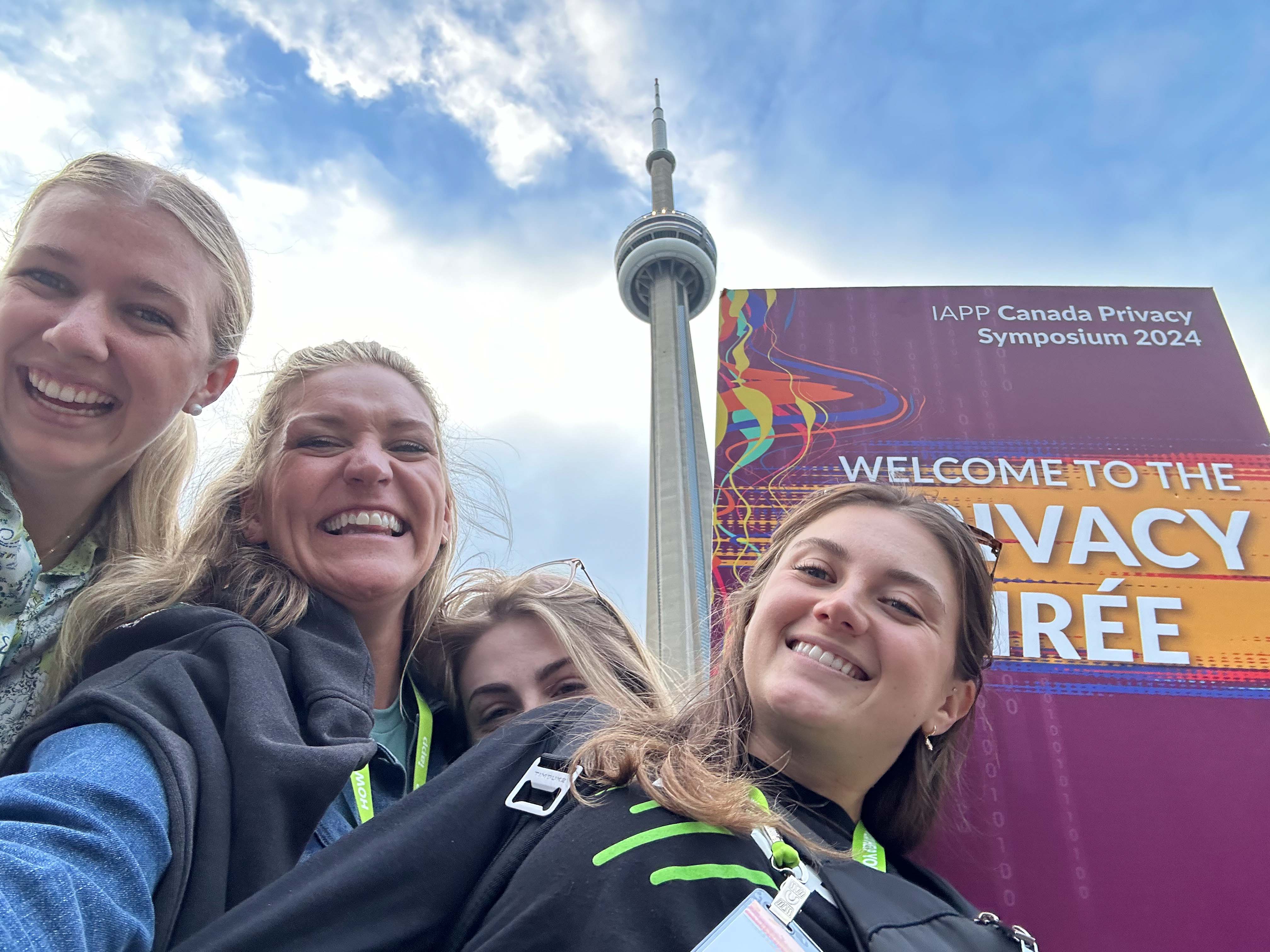 IAPP staff posing for a photo outdoors at a conference