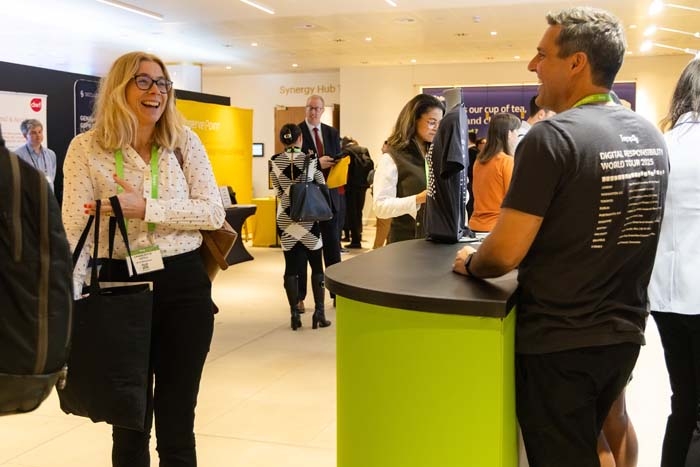 An IAPP staff member on the right talking to a conference participant on the left