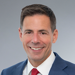 headshot of John Carlin