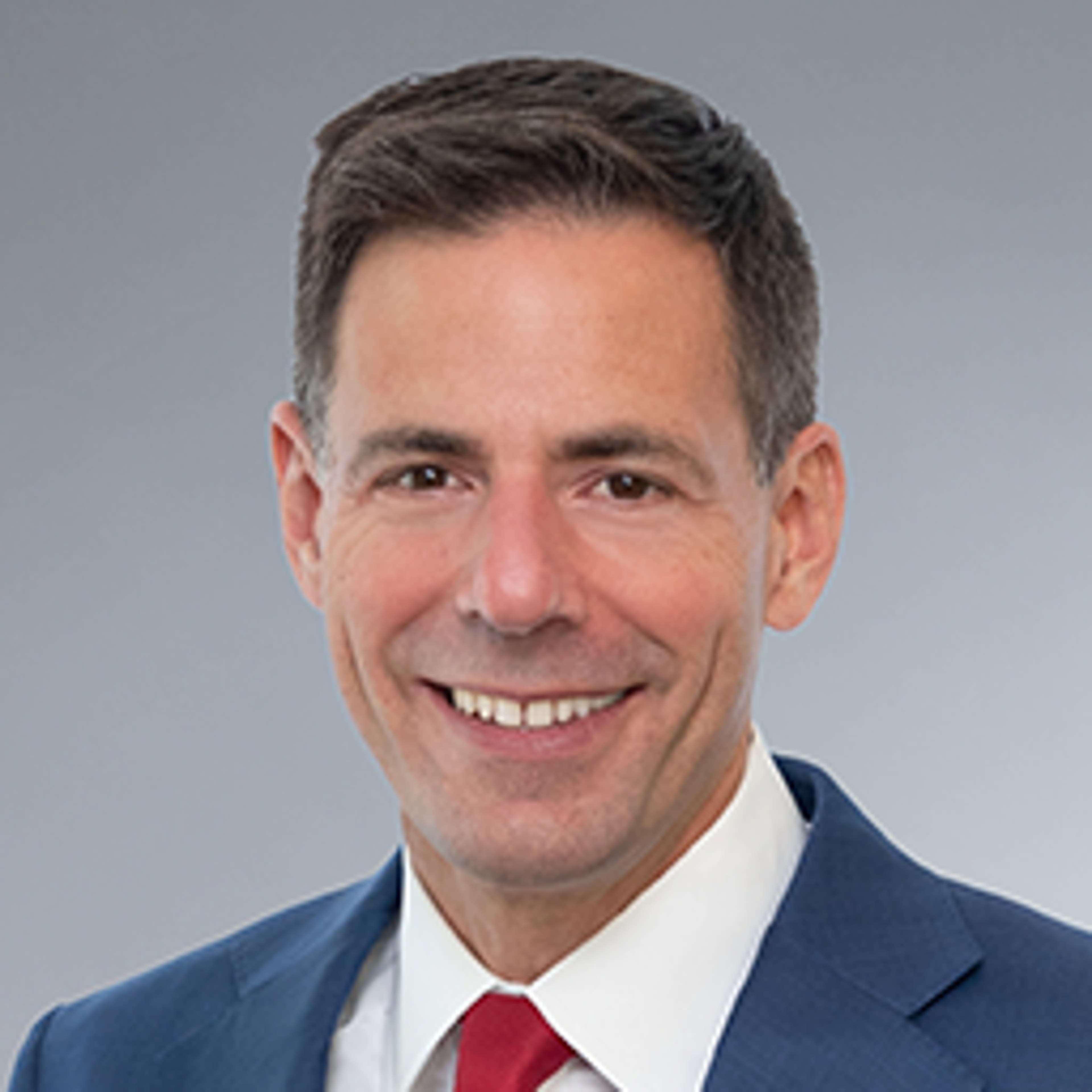 headshot of John Carlin