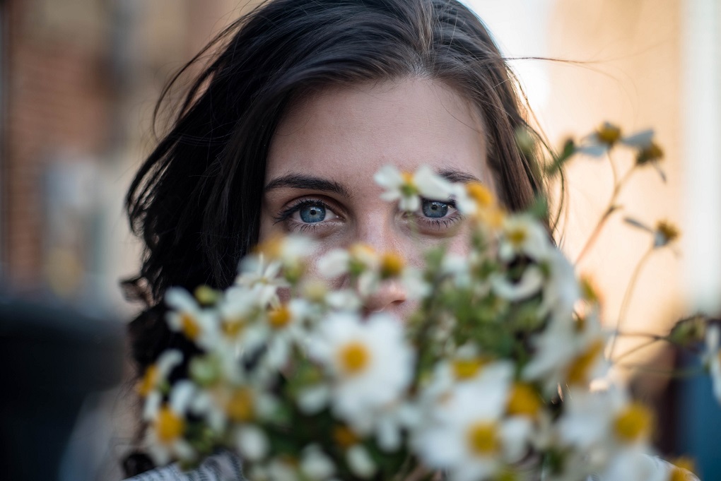 woman-peeking-flowers-biometrics.jpg