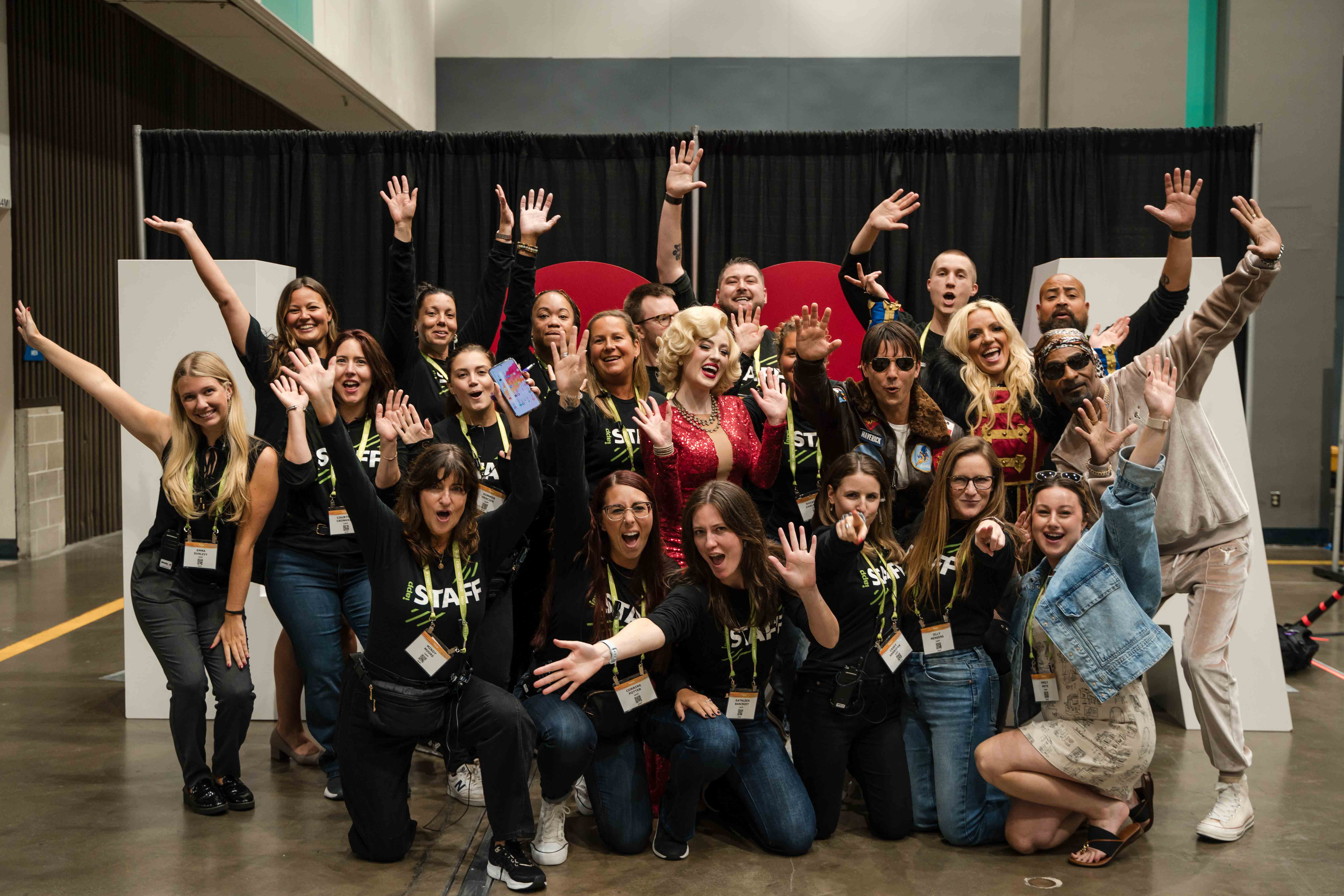 A group of IAPP staff taking a photo at a conference.