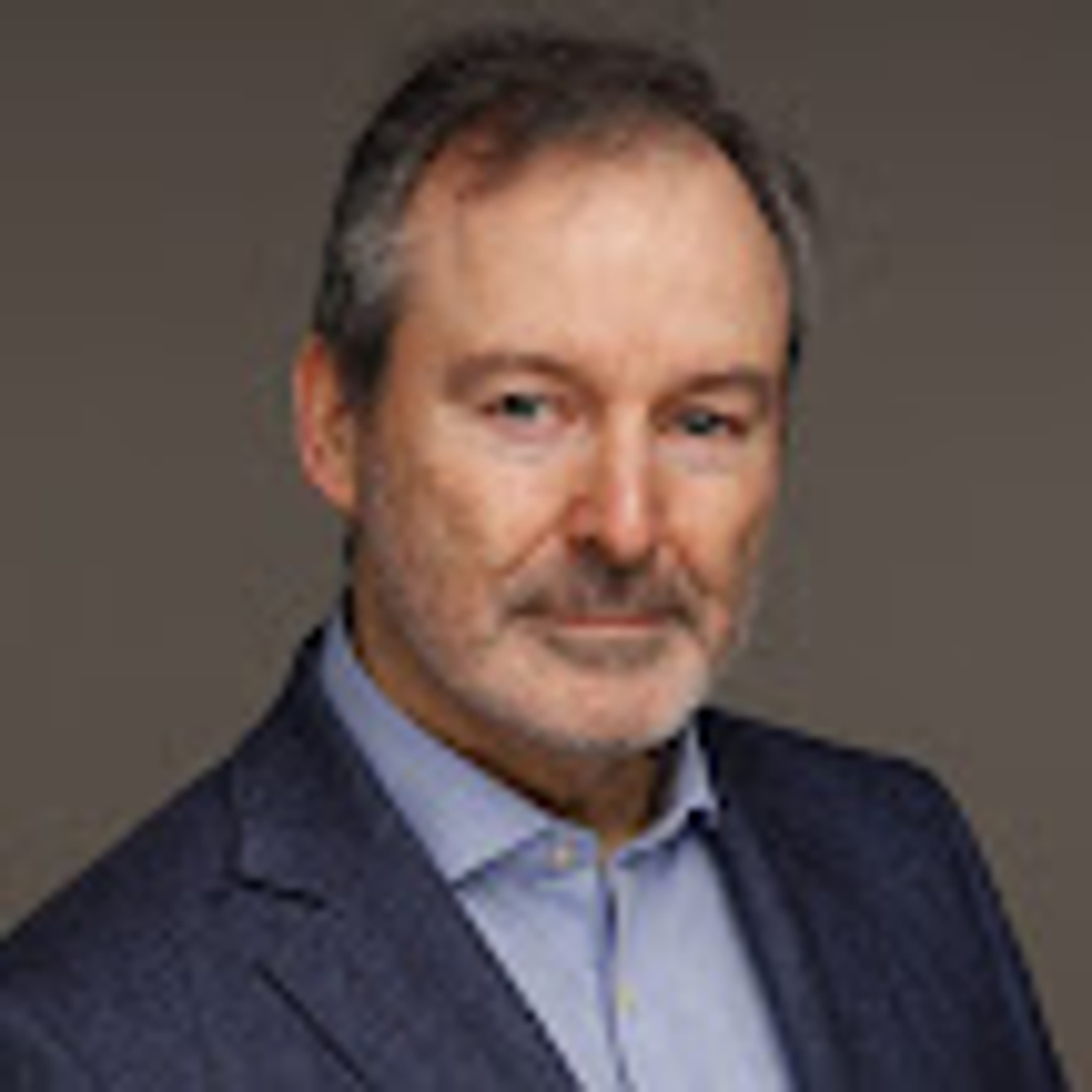 headshot of Etienne De Burgh