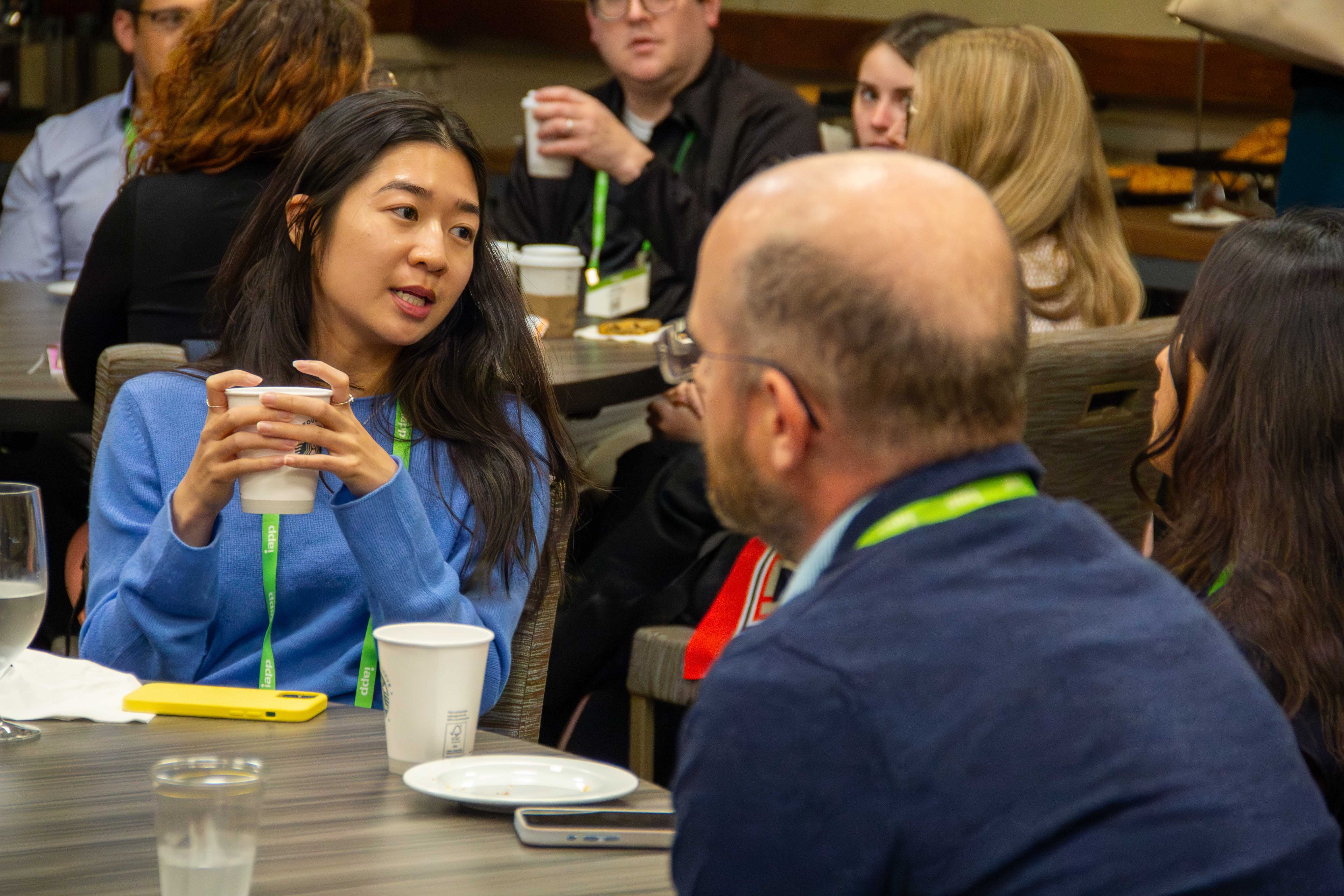 A man and a woman talking at a Privacy Bar section meetup