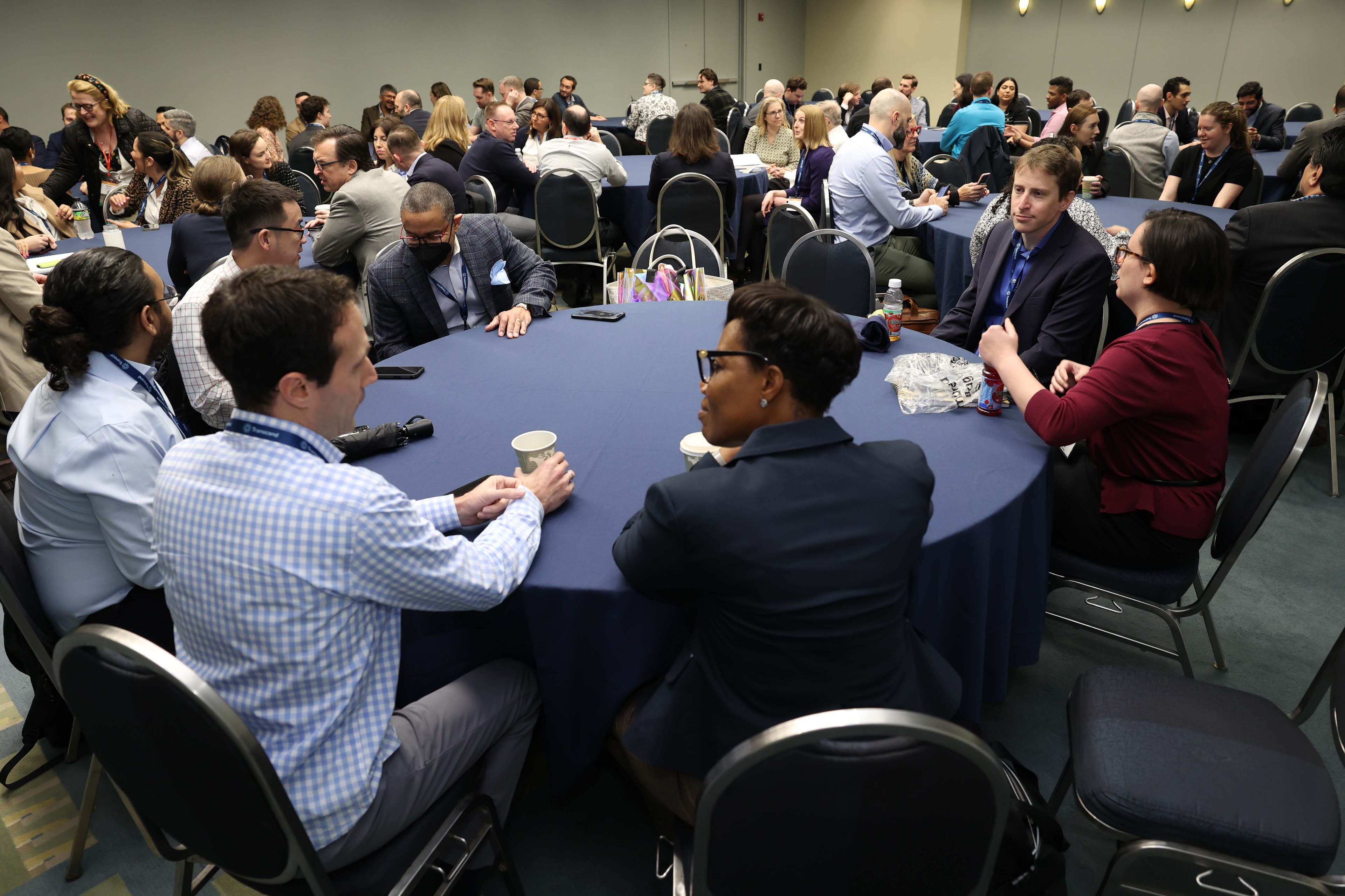 A table full of people conversing at a Privacy Bar section meetup