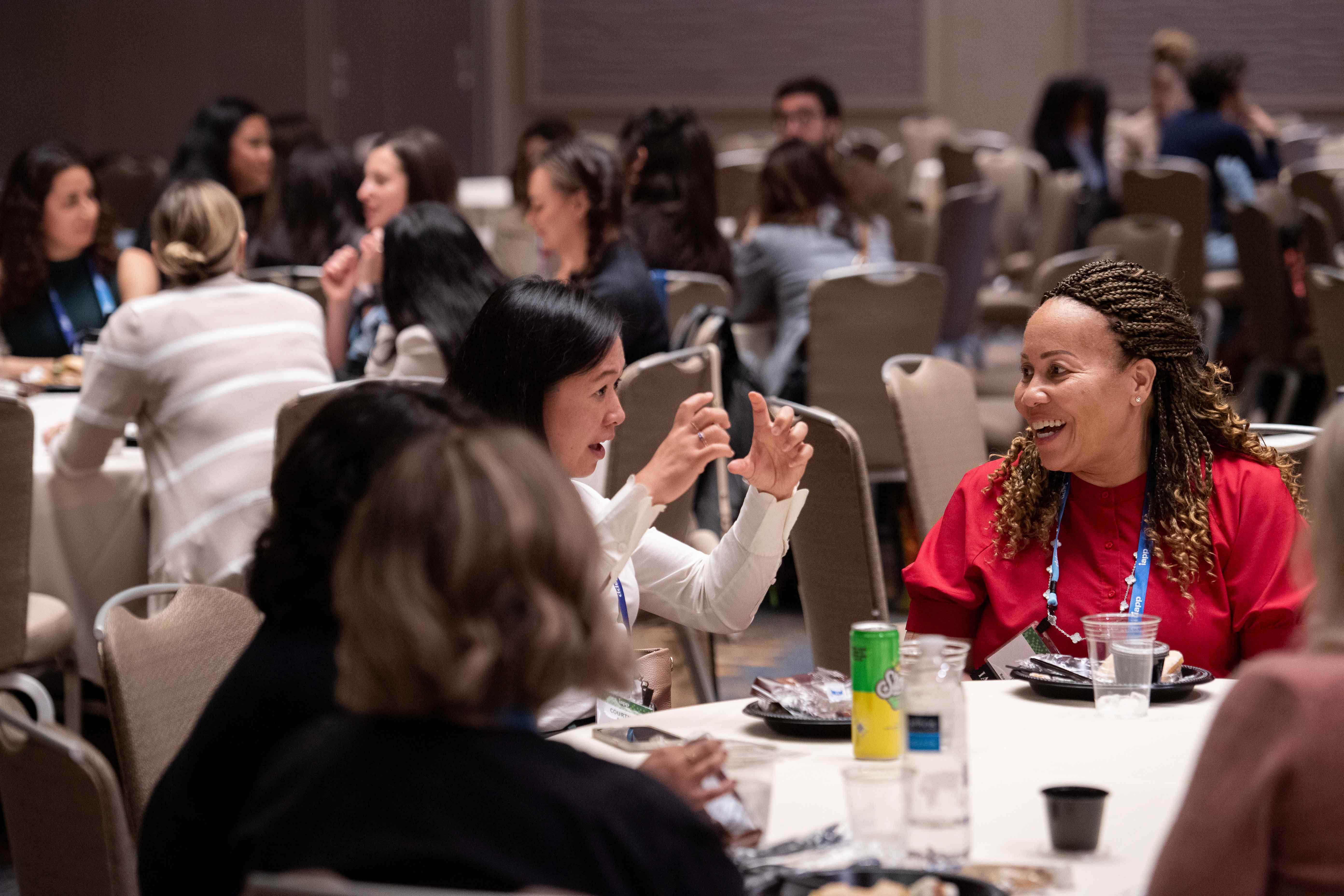 A group of women at a Women Leading Privacy meetup, sitting around a table