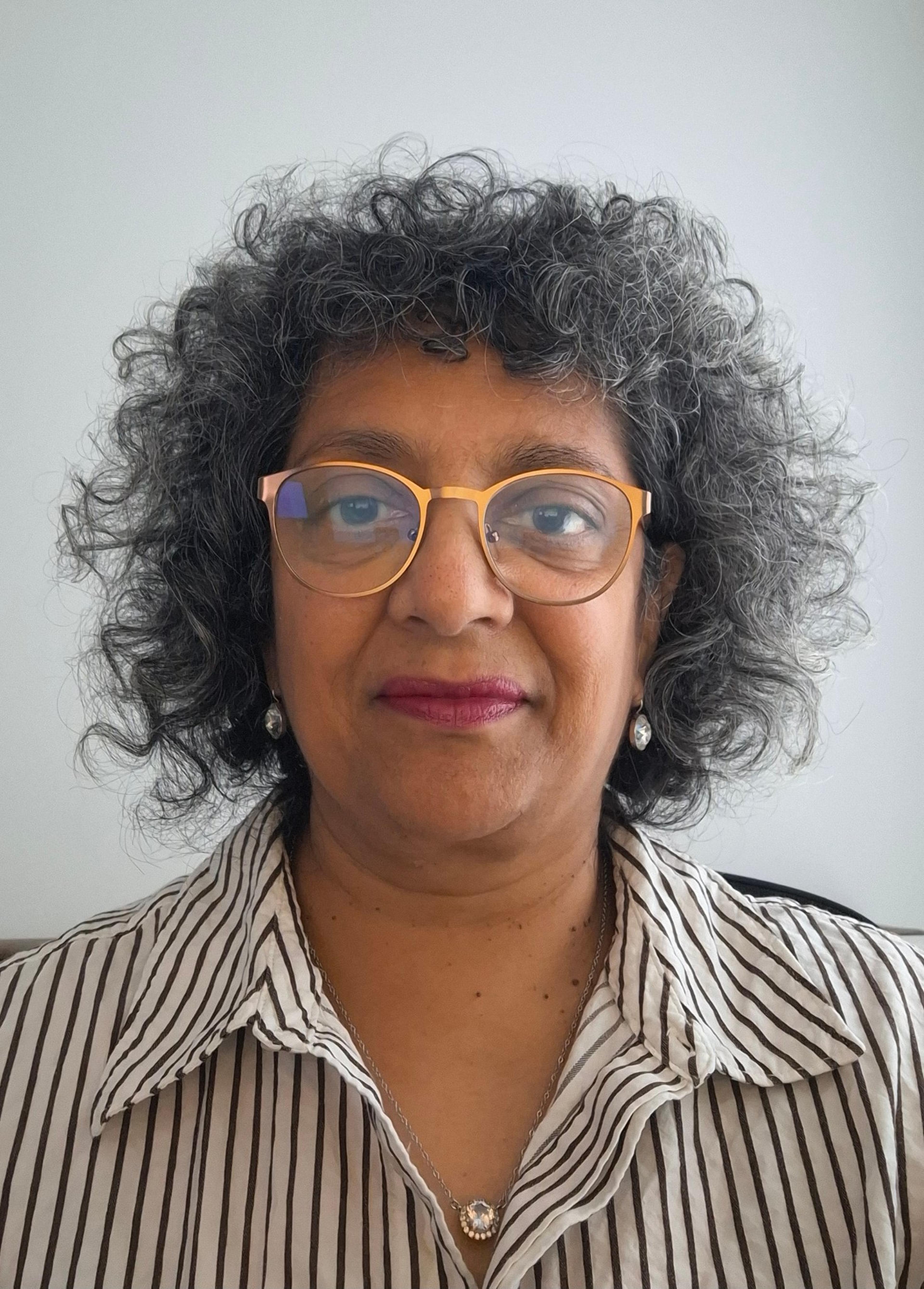 headshot of Nina Barakzai