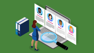 Person looking at profiles on a laptop screen with a magnifying glass and binders nearby.