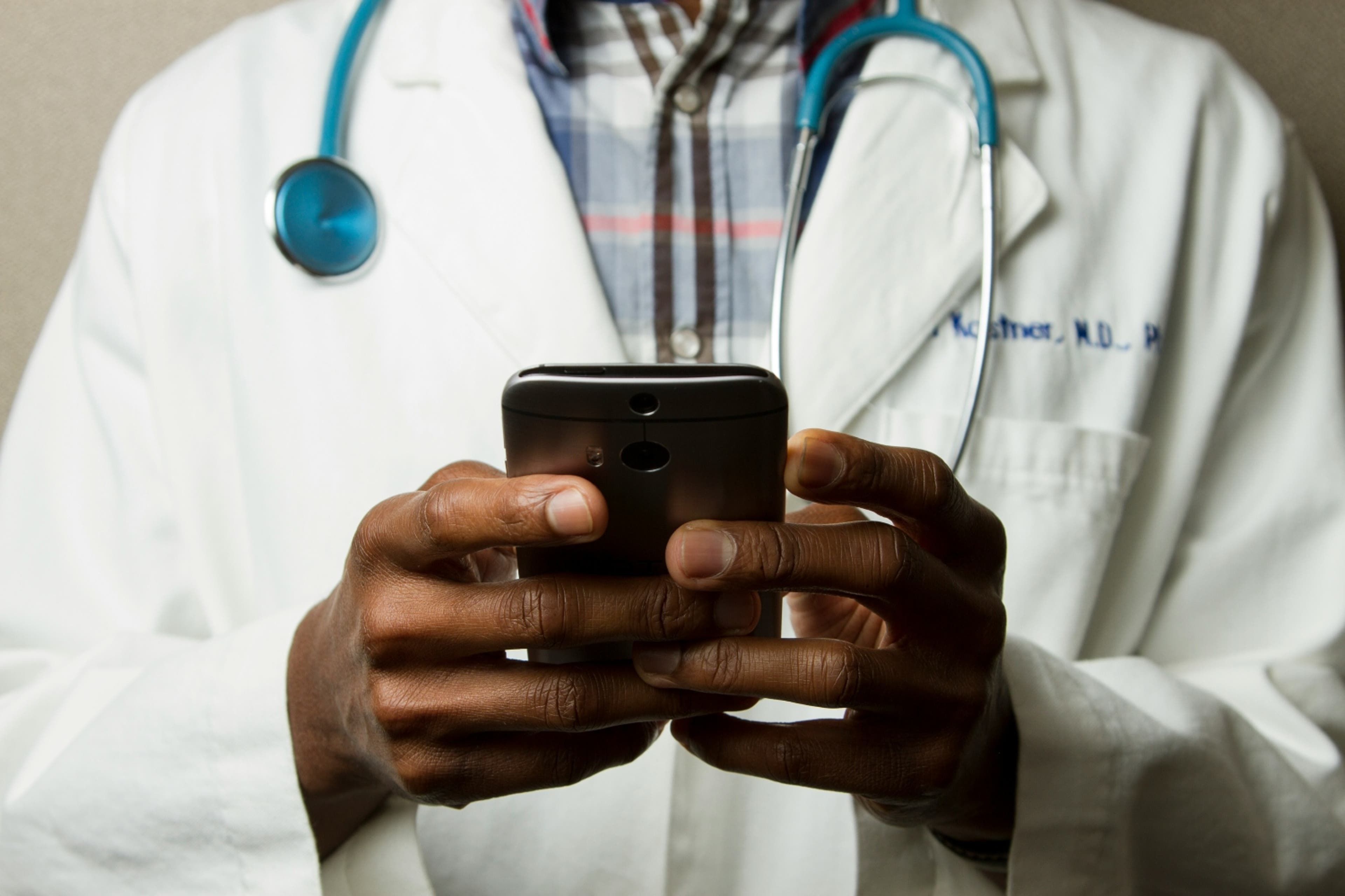 doctor-holding-phone-healthcare-081324.jpg