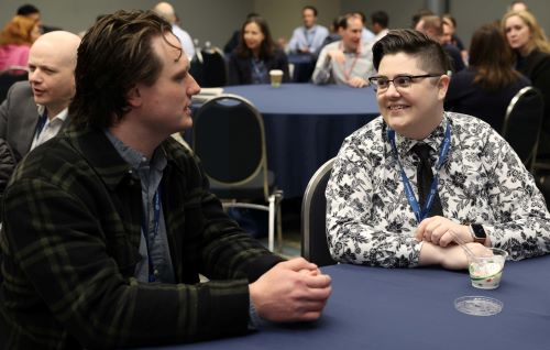 Two people talking at a Privacy Bar section meetup