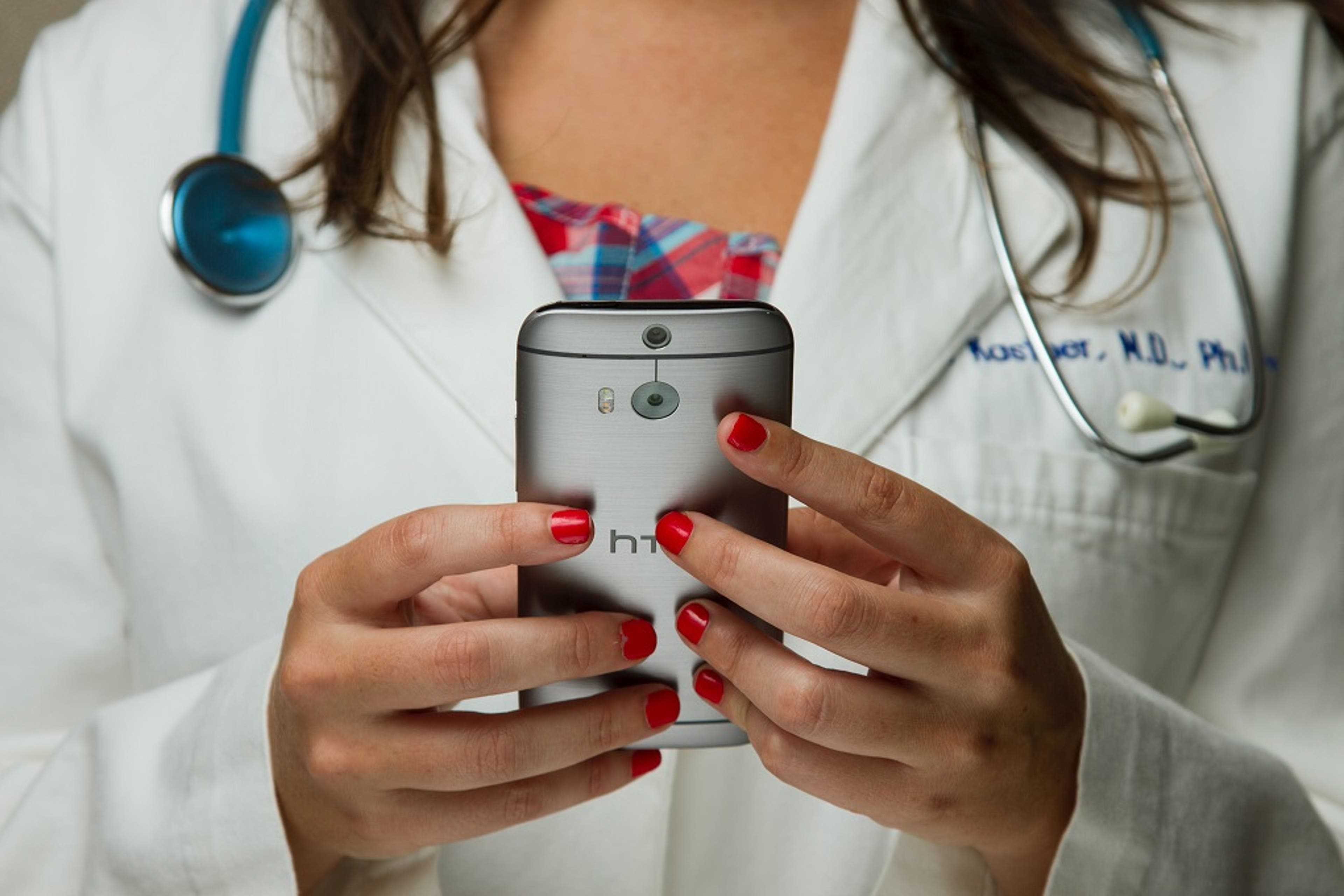 doctor-holding-phone-healthcare.jpg