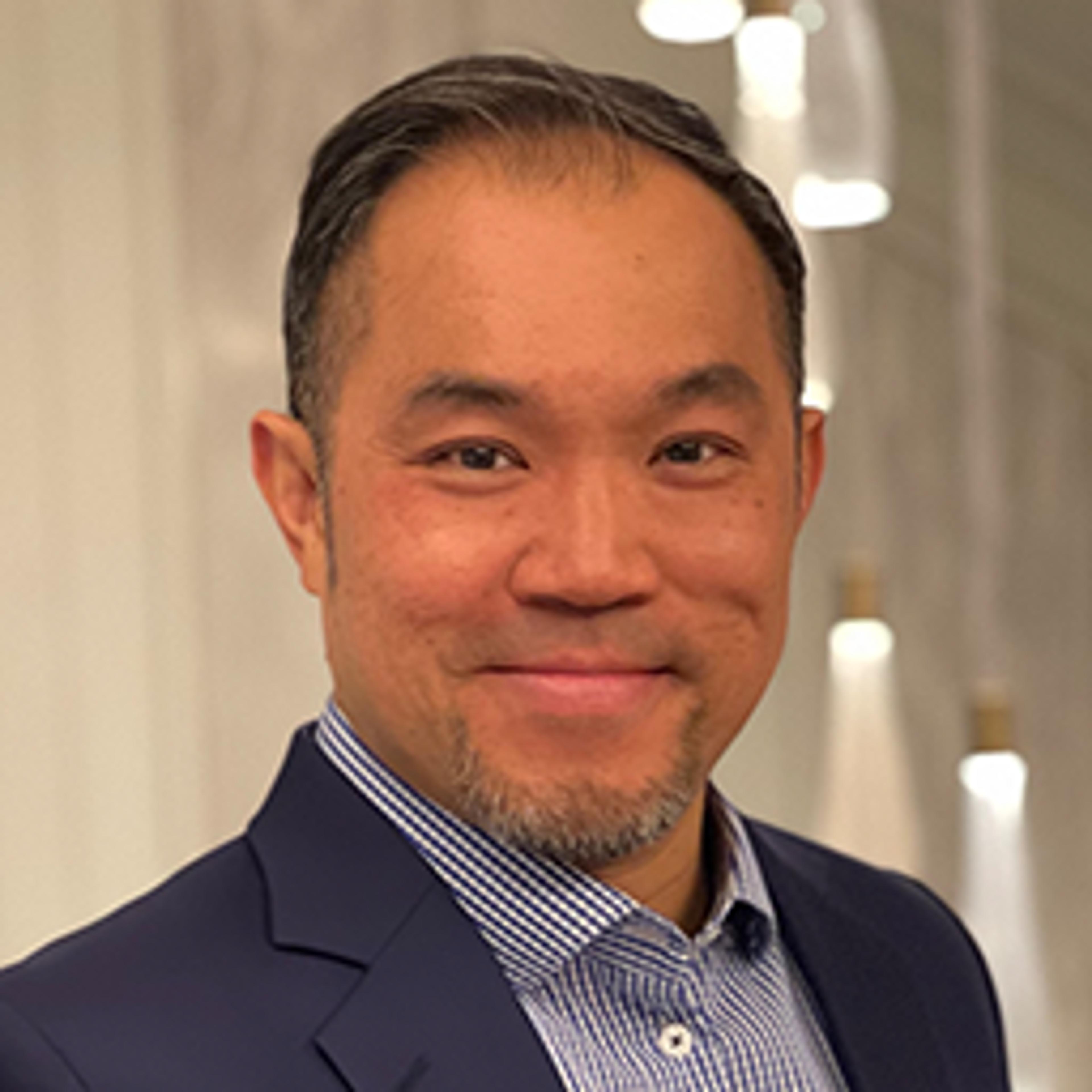 headshot of Adrian Leung