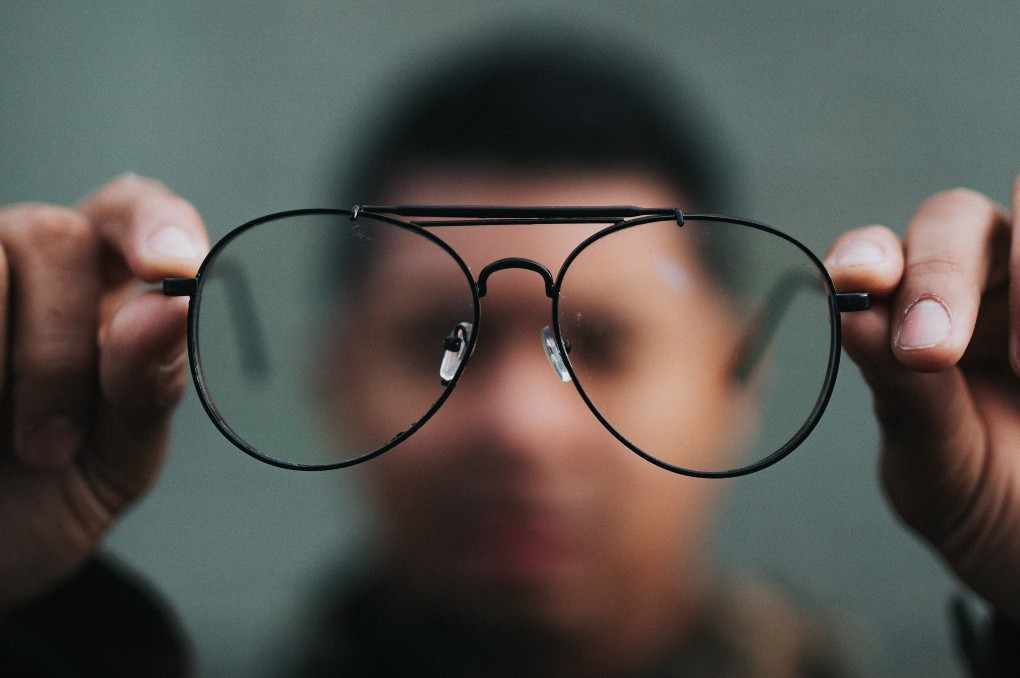 holding-glasses-blurred-other.jpg