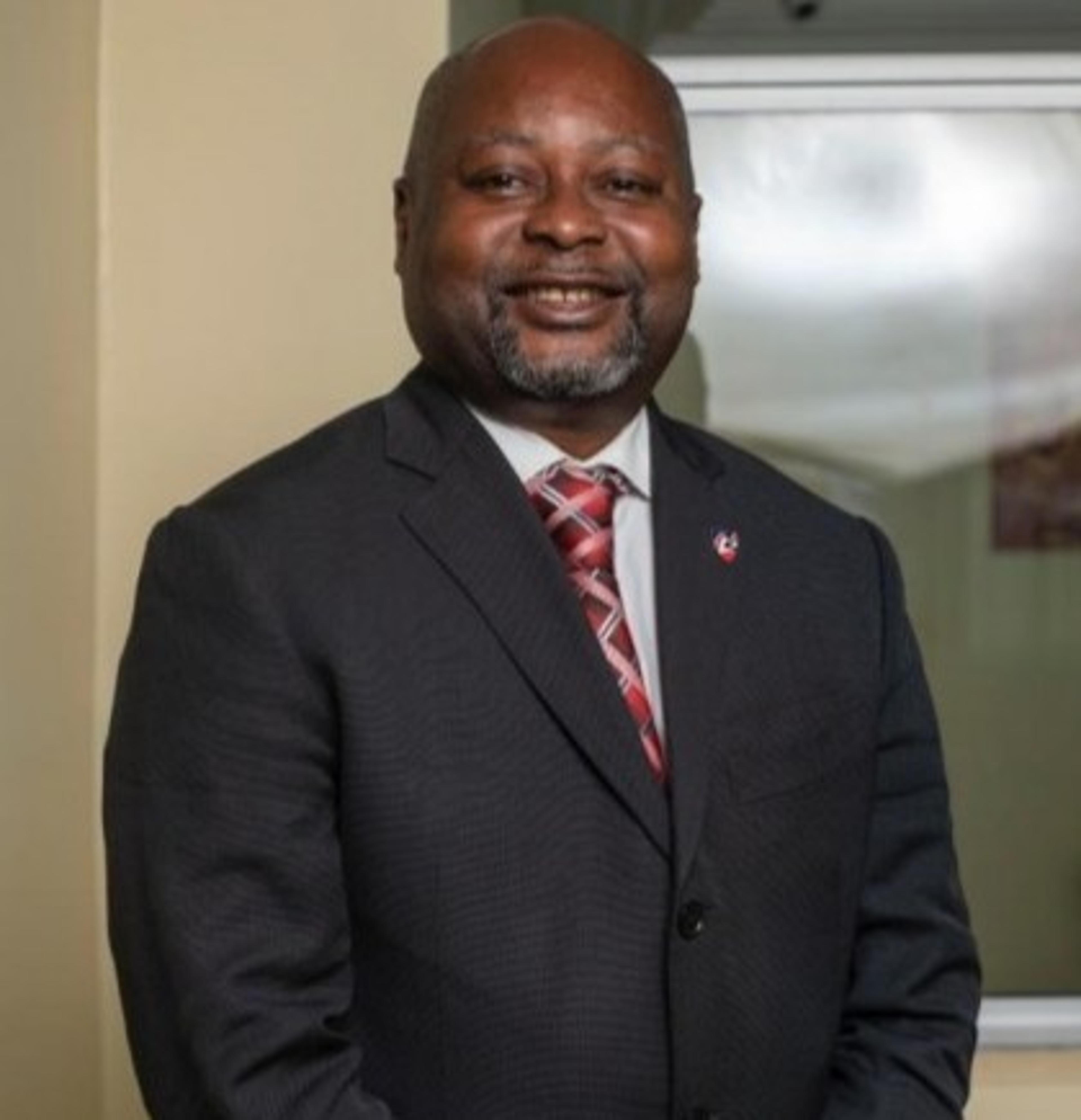 headshot of Mbella Charles Mbome