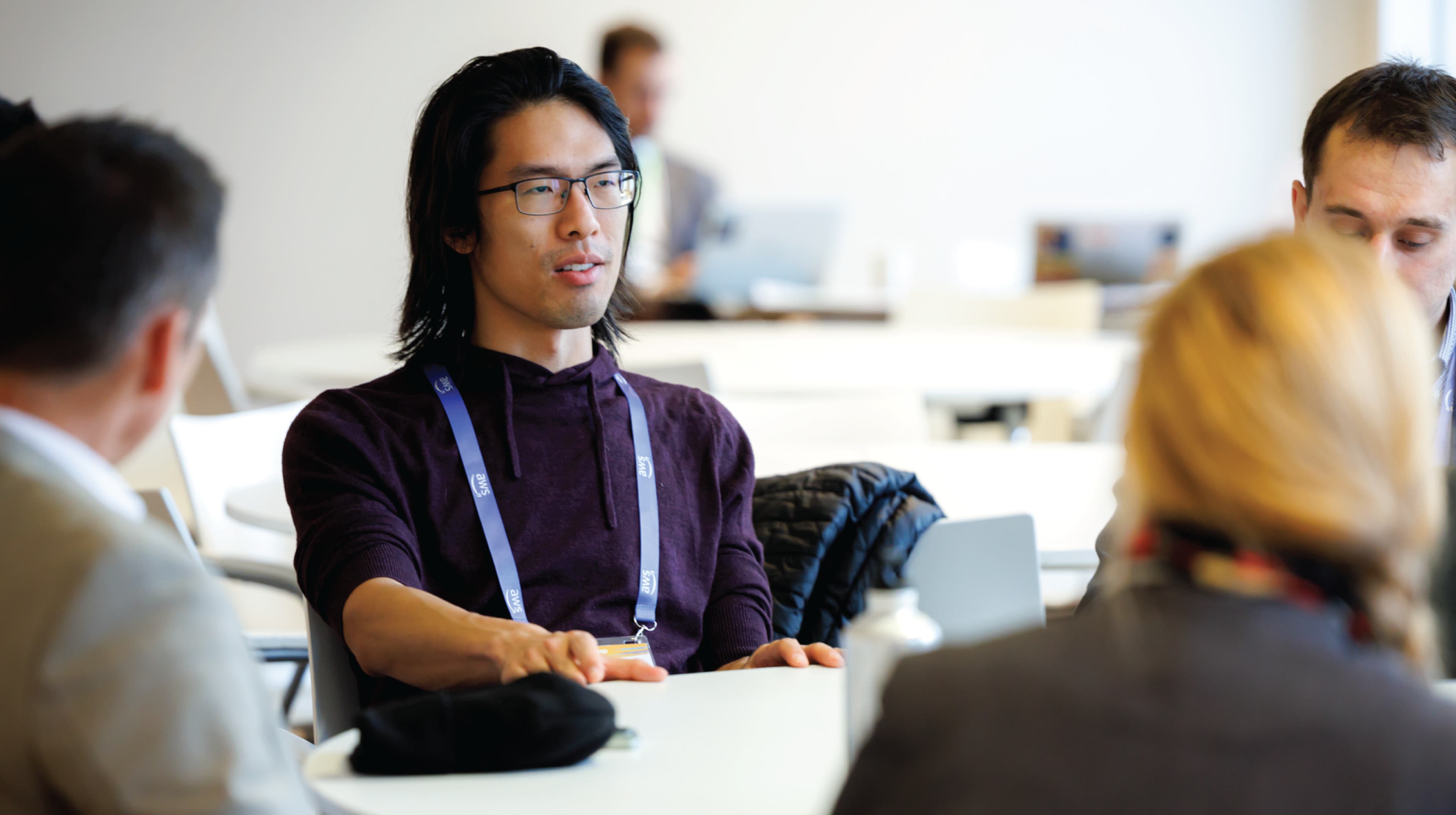 two women in business attire looking at the camera and smiling