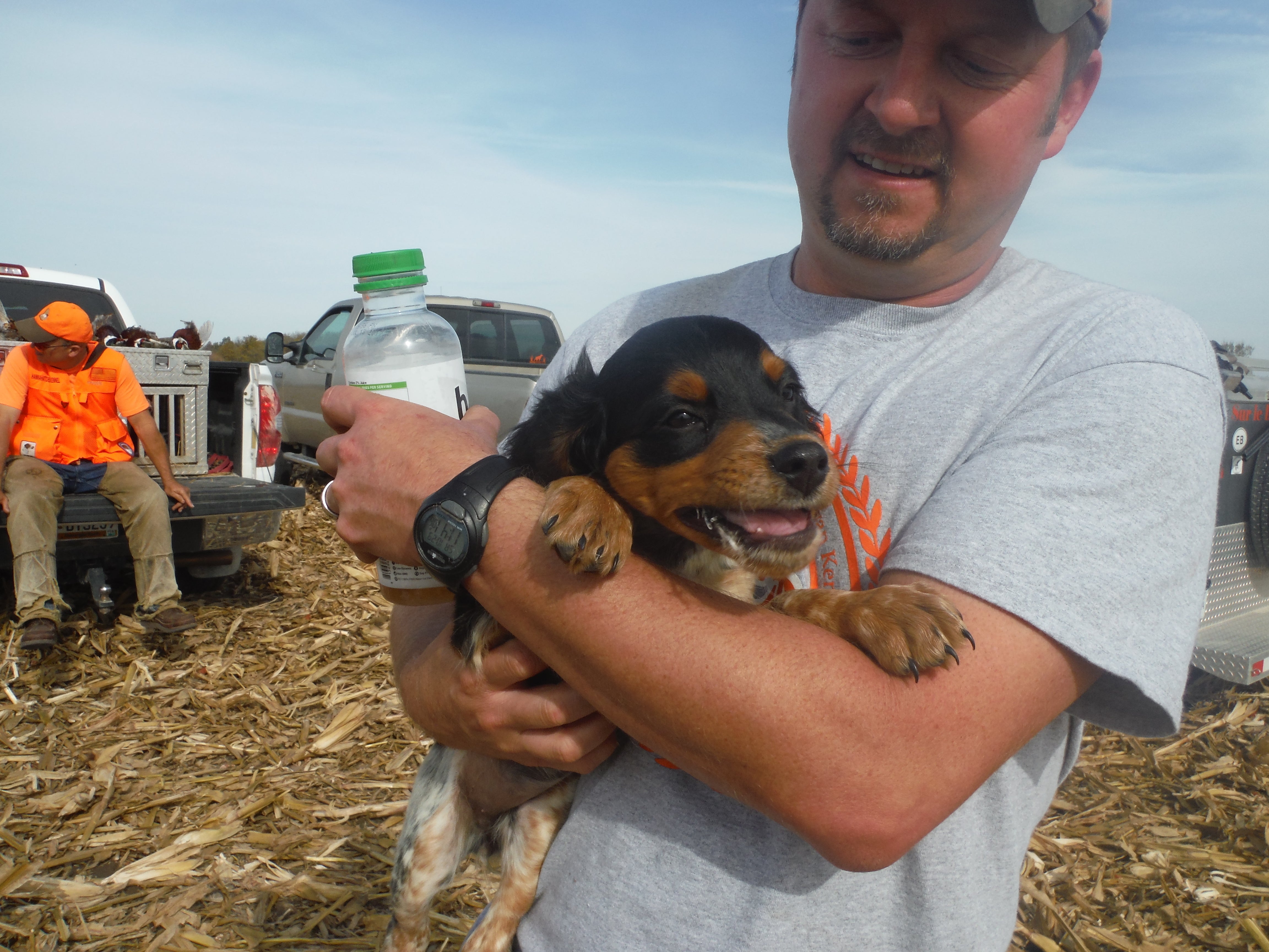 Man holding a puppy