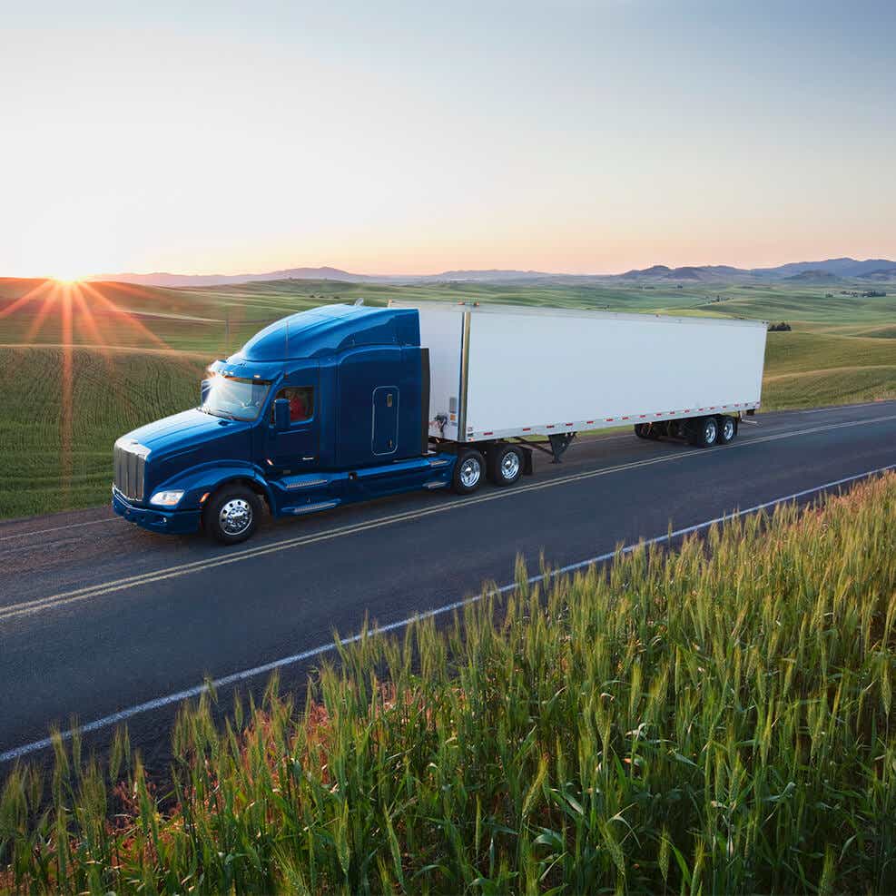 image of truck delivering timely agricultural deliveries