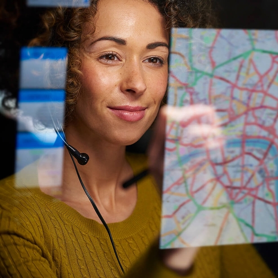 supply chain optimizations image woman reviewing delivery routes on screen