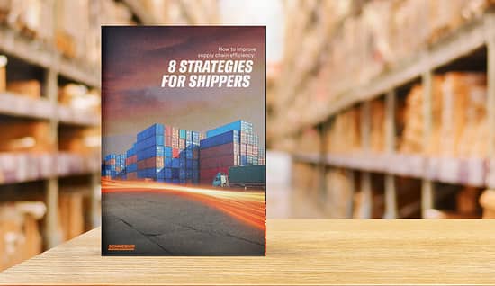 Guidebook to supply chain efficiency propped up on wood surface inside a warehouse