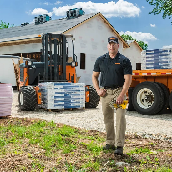 Contractor Loading Heavy Equipment & Construction Shipping | Schneider