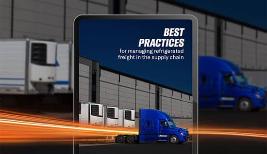 dedicated-refrigerated-guide-hero.jpg Tablet screen displaying a semi-truck parked next to refrigerated freight trailers