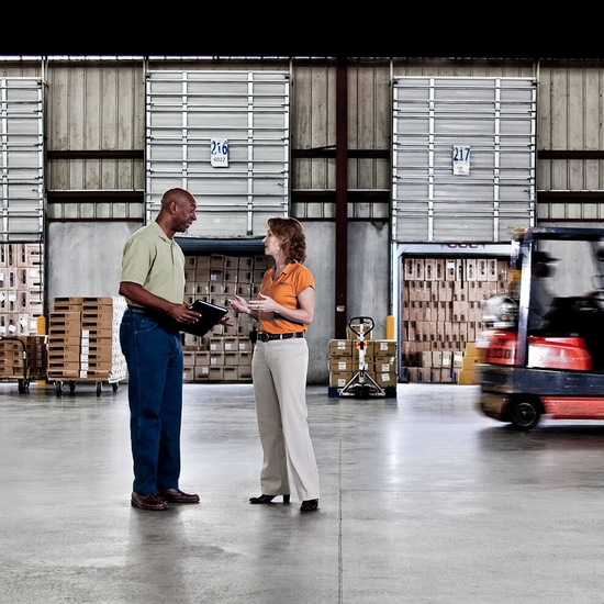 expedited freight team at warehouse with cargo