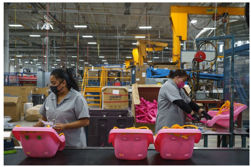 Workers on an assembly line